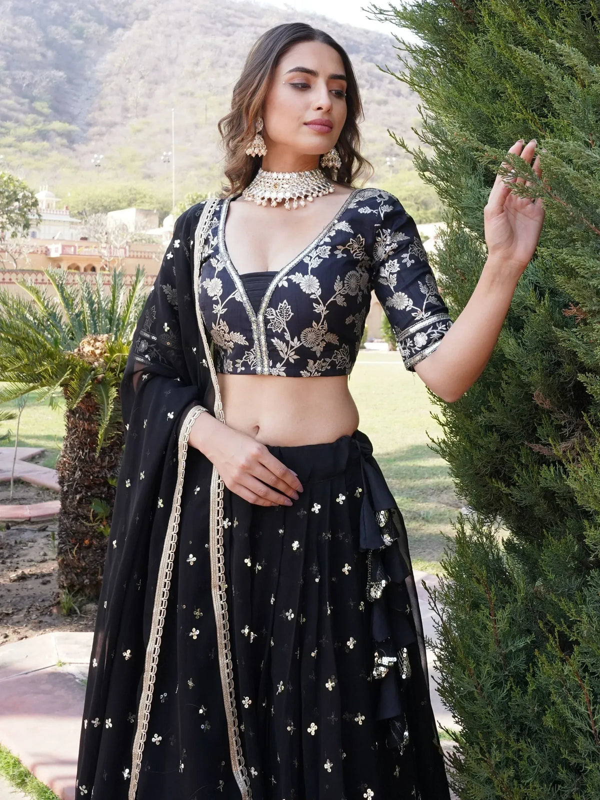 Black embroidered lehenga choli with gold floral work, perfect for Indian ethnic wear occasions