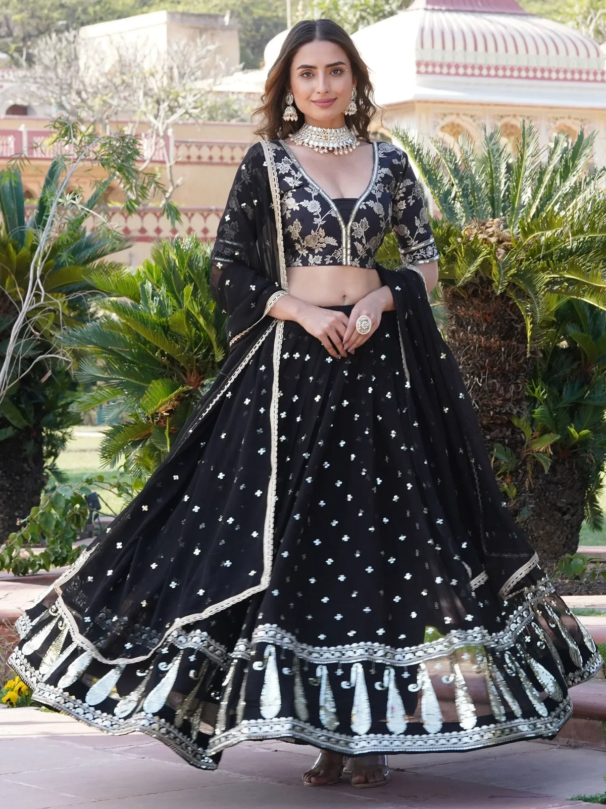Black embroidered lehenga choli with gold detailing, perfect for Indian ethnic wear and festive occasions.
