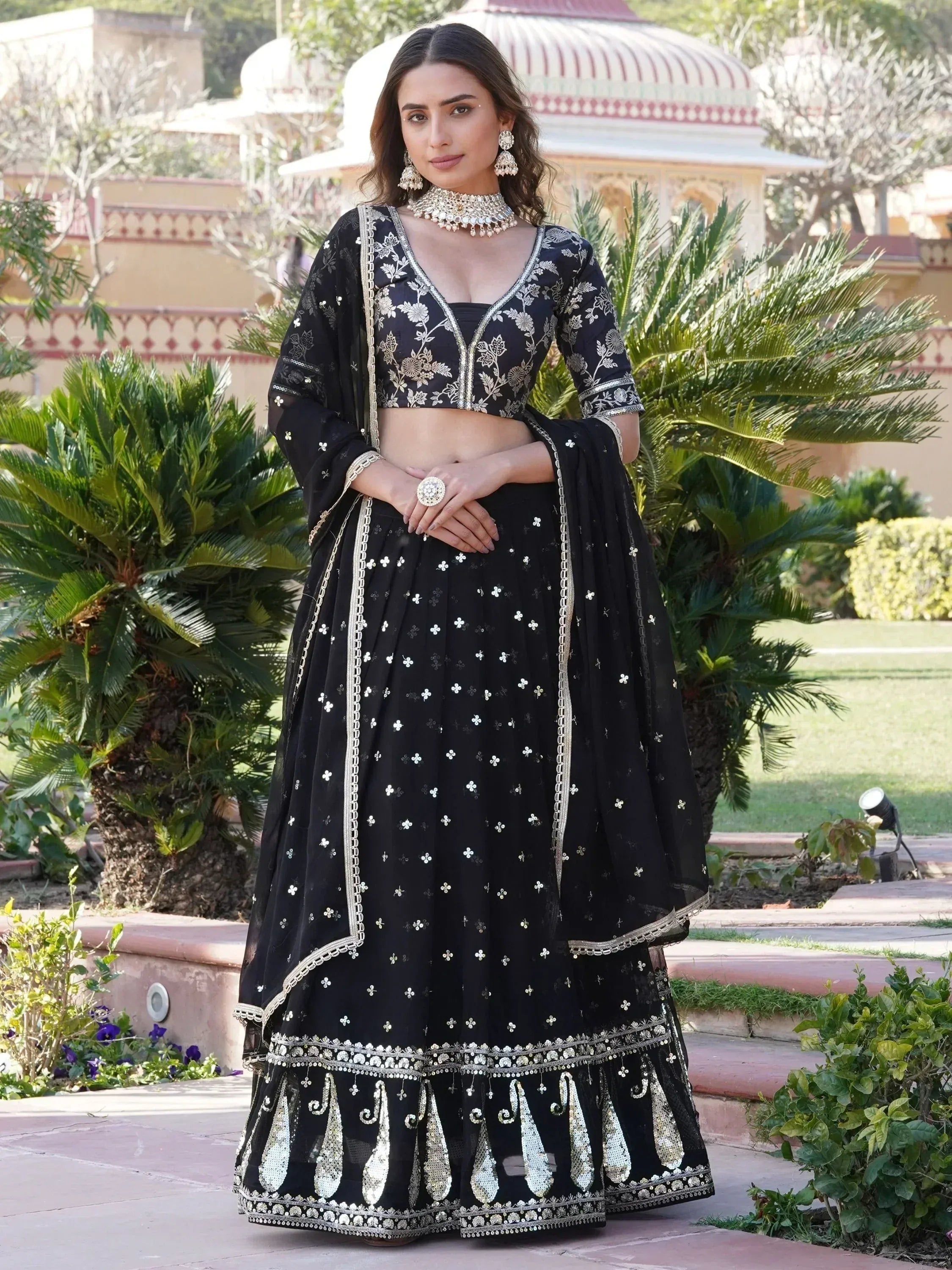 Black embroidered lehenga choli with gold detailing, perfect for Indian ethnic wear occasions