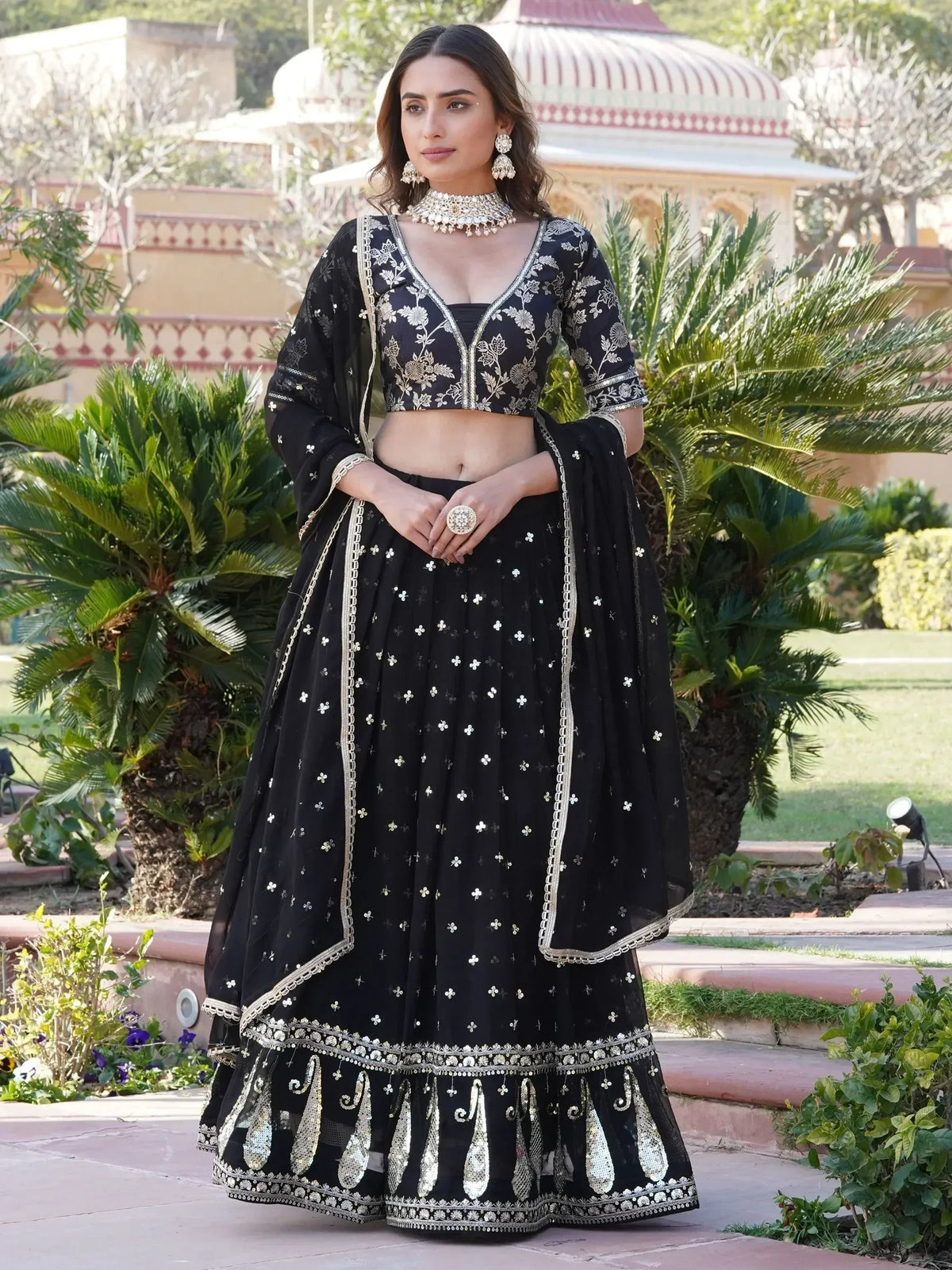 Black embroidered lehenga choli with gold detailing, perfect for Indian ethnic wear and festive occasions