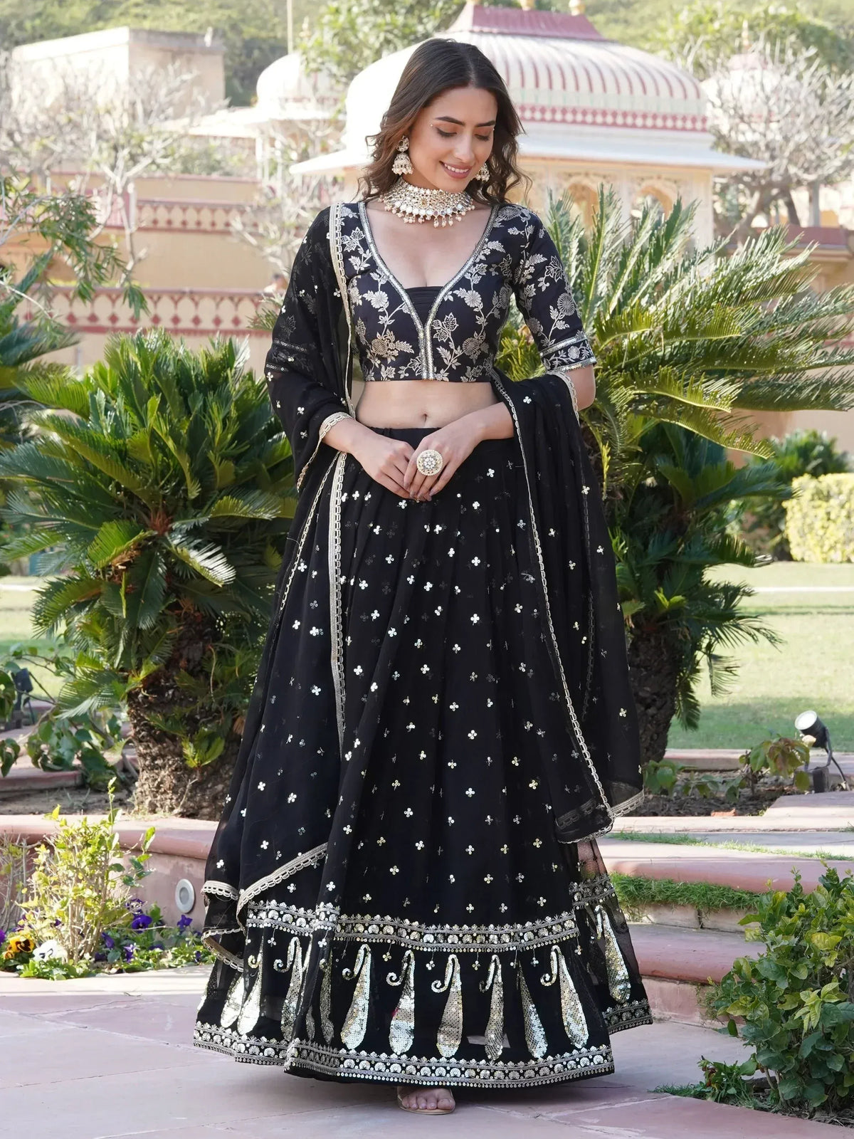 Black embroidered lehenga choli with gold detailing, perfect for Indian ethnic wear and festive occasions.