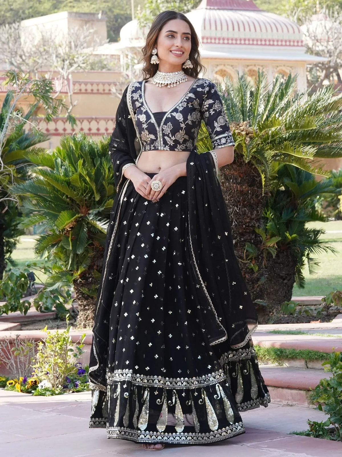 Black embroidered lehenga choli with gold detailing, perfect for Indian ethnic wear and festive occasions.