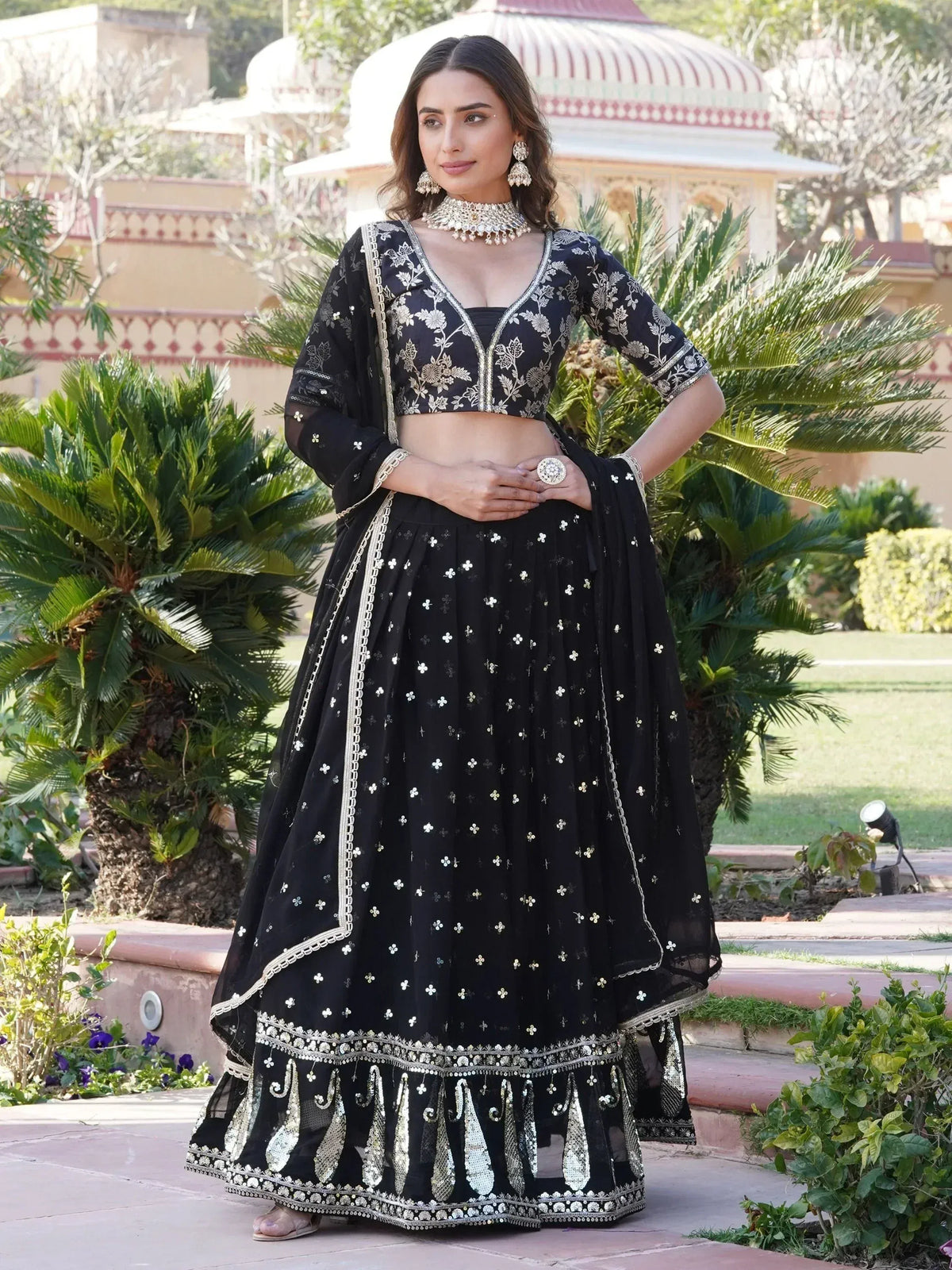Black embroidered lehenga choli with gold detailing, perfect for Indian ethnic wear occasions