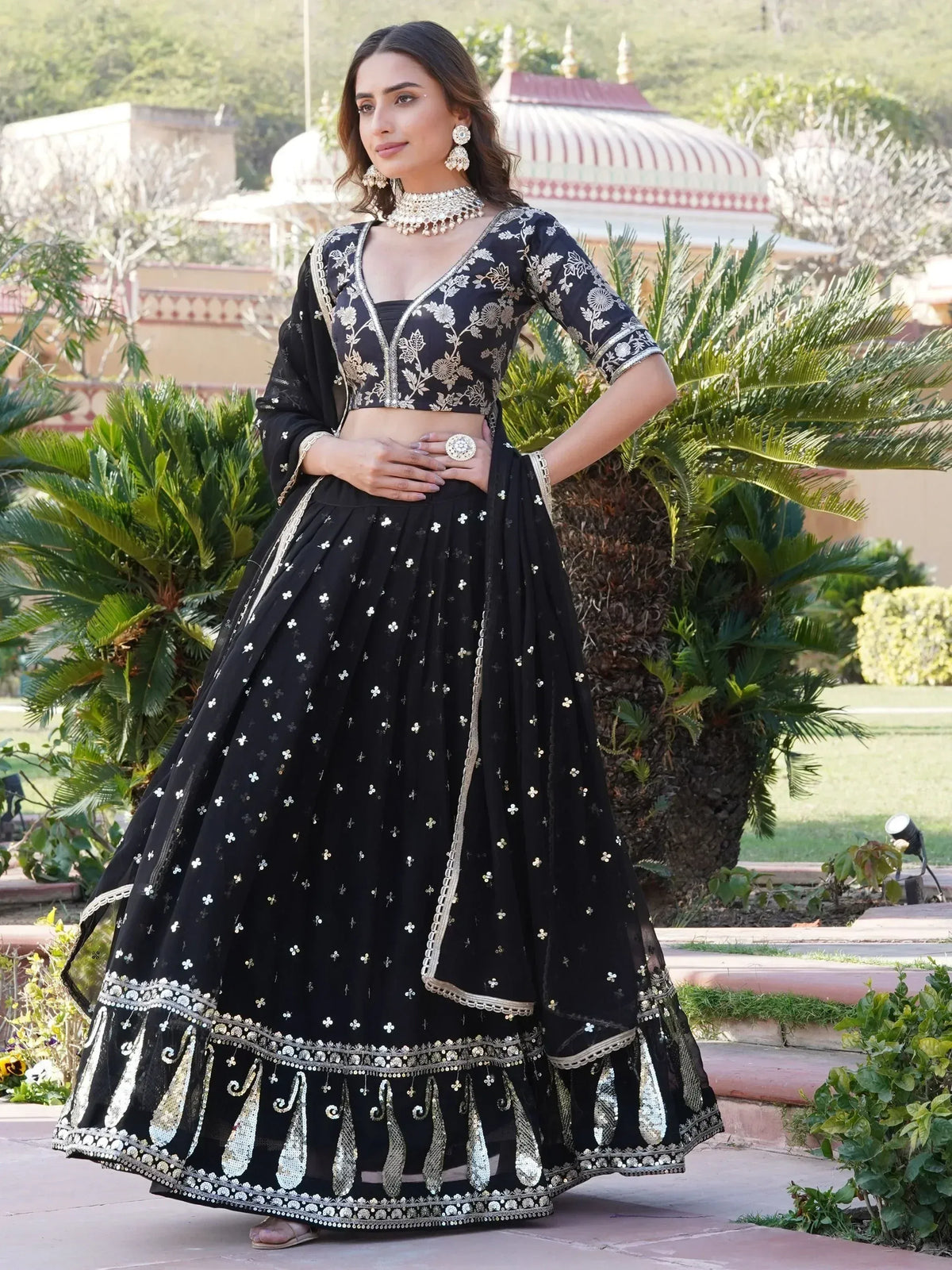 Black embroidered lehenga choli with gold detailing, perfect for Indian ethnic wear events