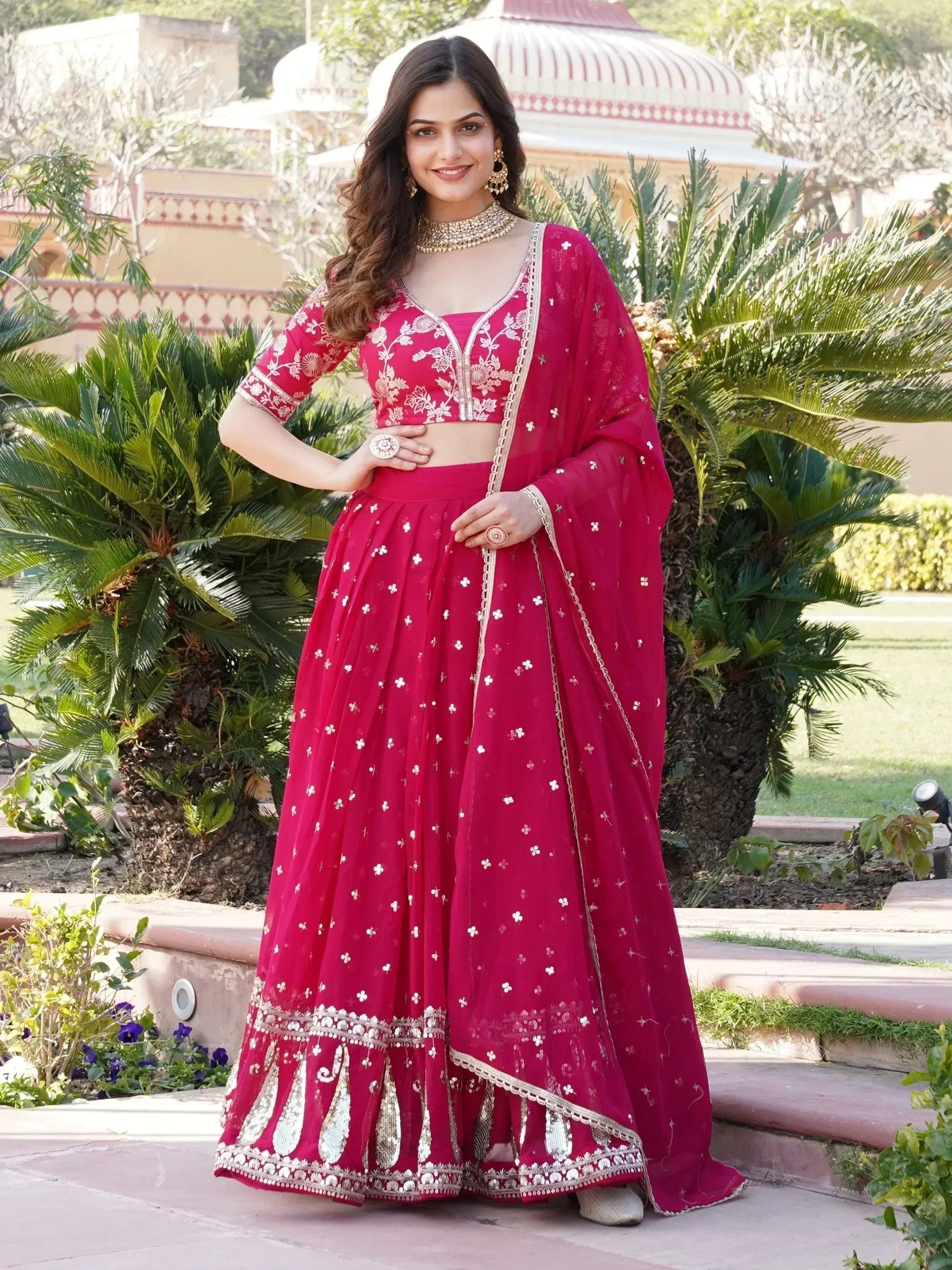 Red embroidered lehenga choli with gold detailing, perfect for Indian ethnic wear and festive occasions.