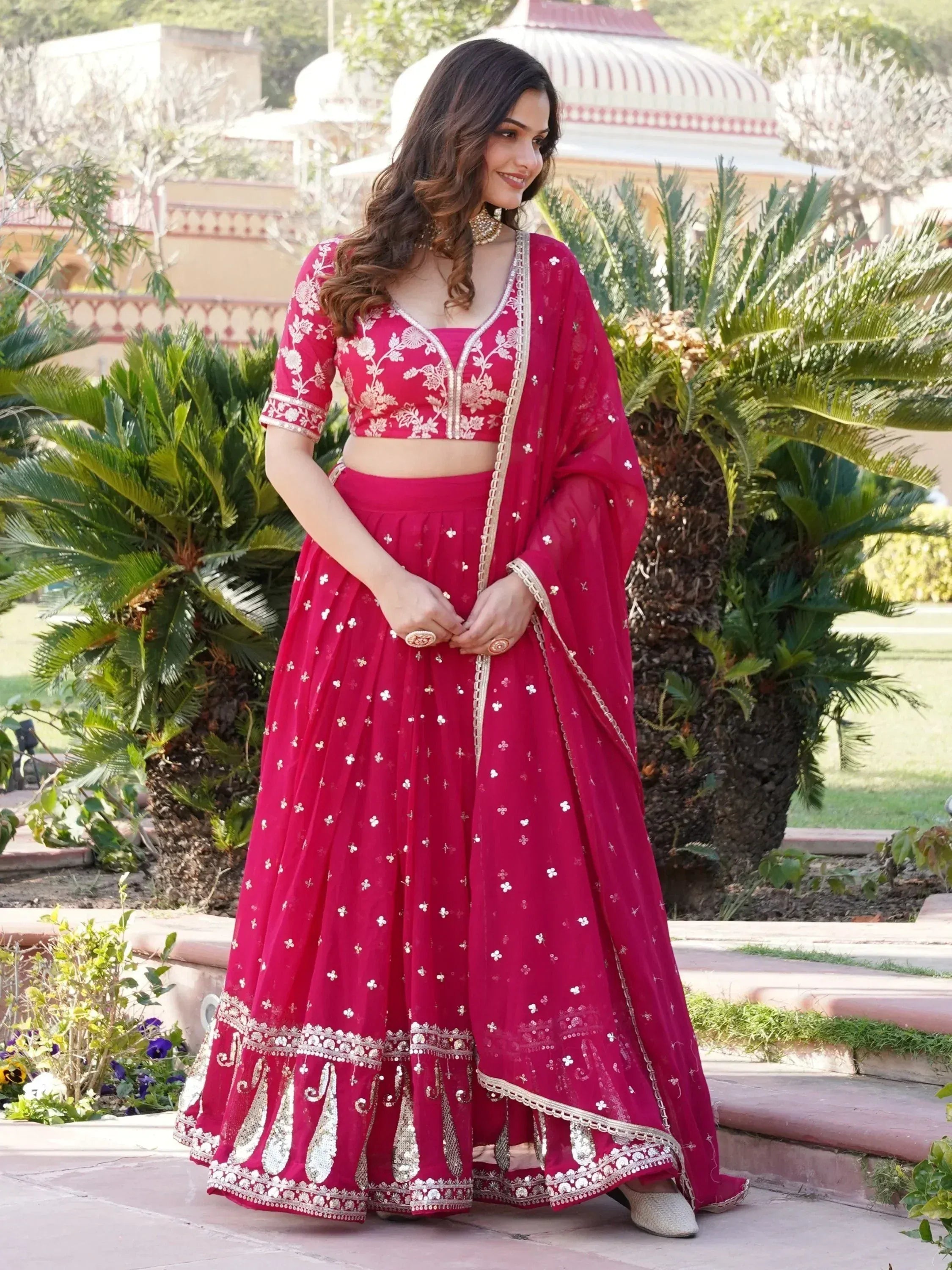 Red embroidered lehenga choli with floral motifs, perfect for Indian ethnic wear and festive occasions