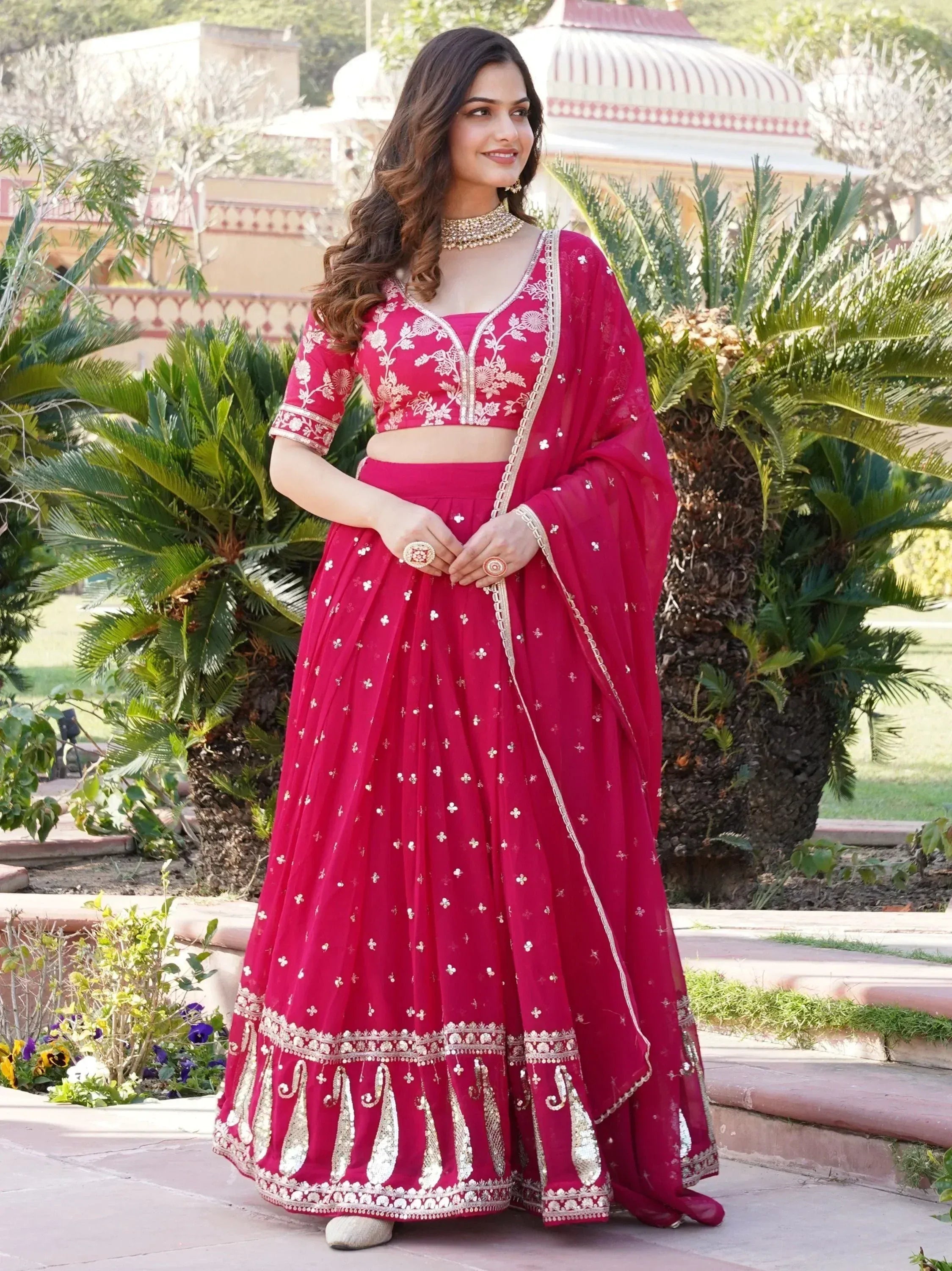 Red embroidered lehenga choli with gold detailing, perfect for Indian weddings and festive occasions