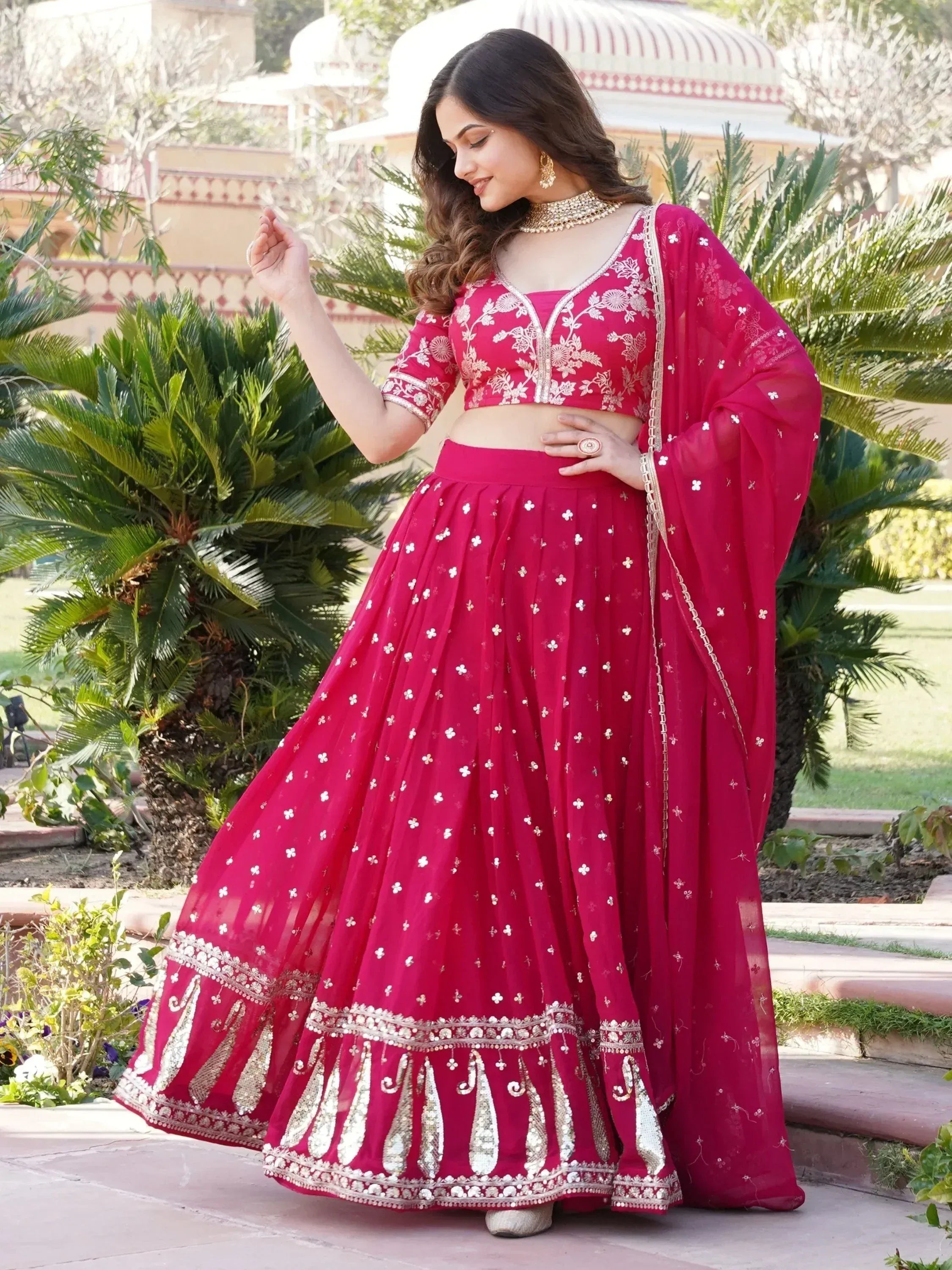 Pink embroidered lehenga choli with gold detailing, perfect for Indian ethnic wear and festive occasions.