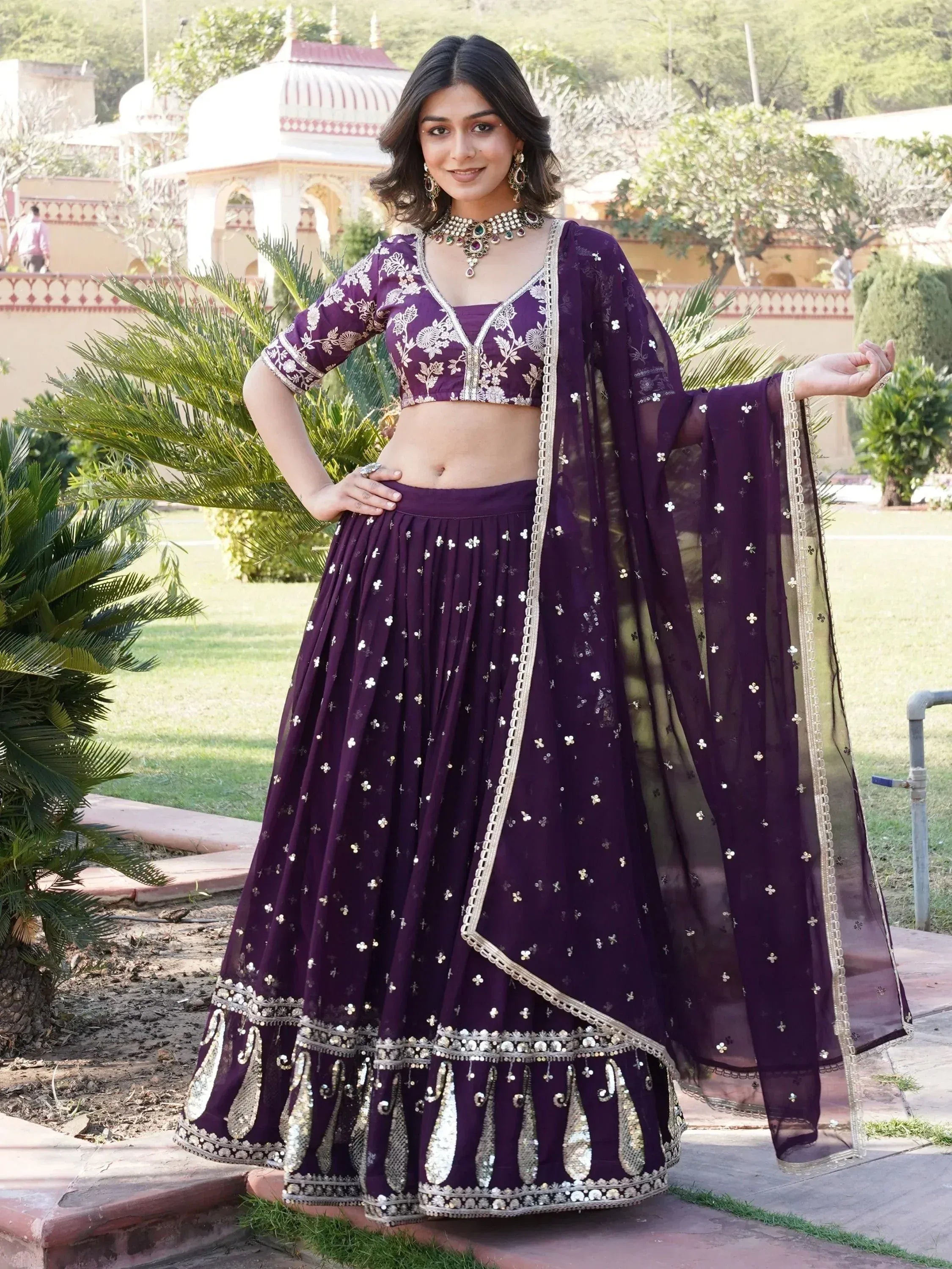 Purple embroidered lehenga choli with gold detailing, perfect for Indian ethnic wear occasions.