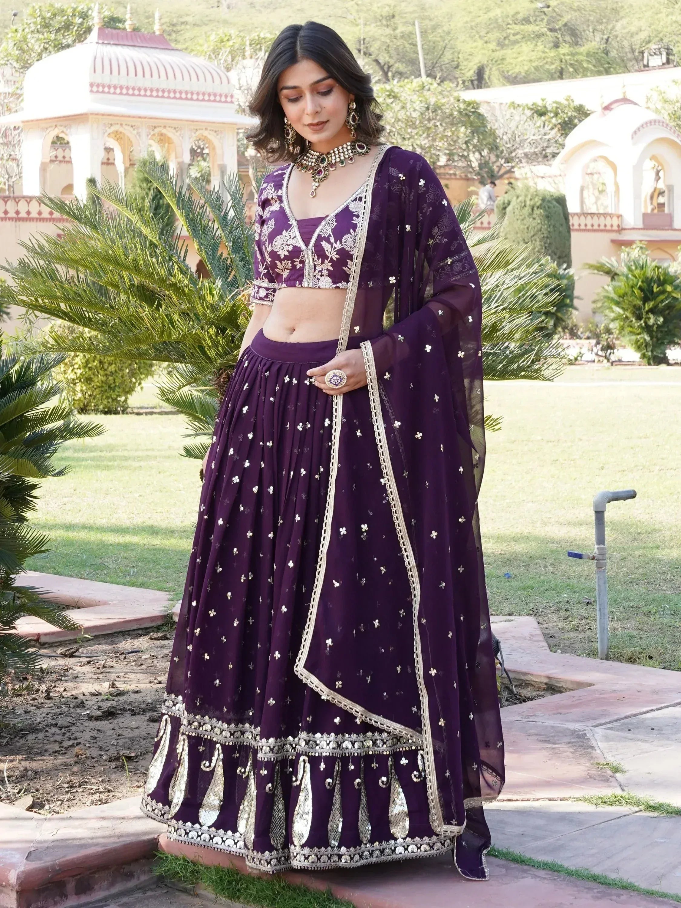 Purple embroidered lehenga choli with gold detailing, perfect for Indian ethnic wear events