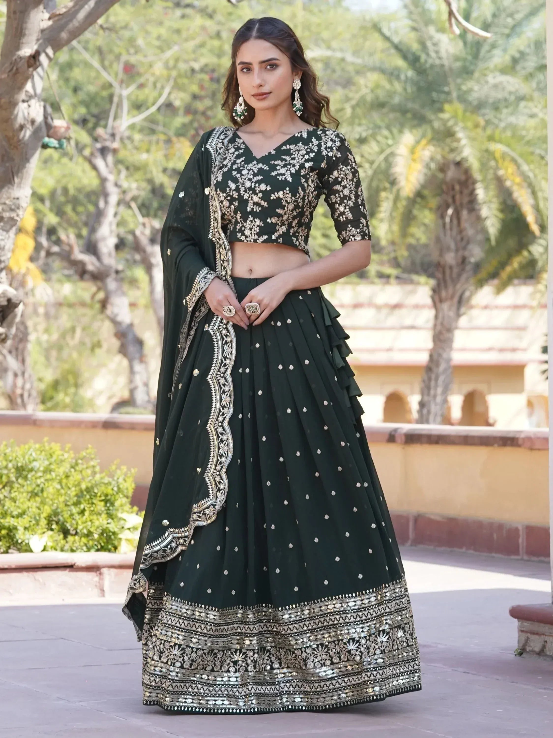 Emerald green embroidered lehenga choli with gold detailing, perfect for Indian ethnic occasions
