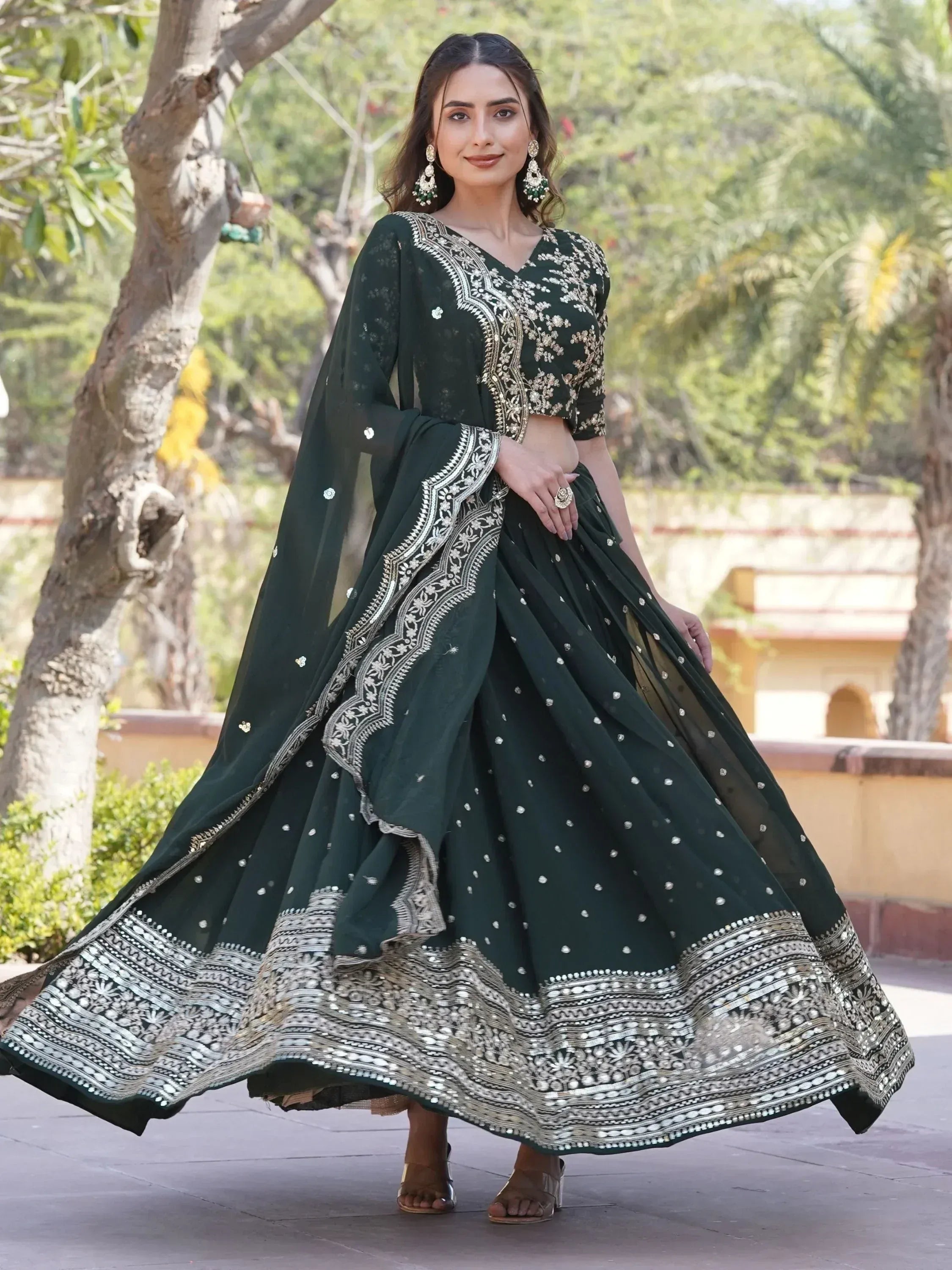 Elegant dark green lehenga choli with silver embroidery, perfect for Indian ethnic occasions