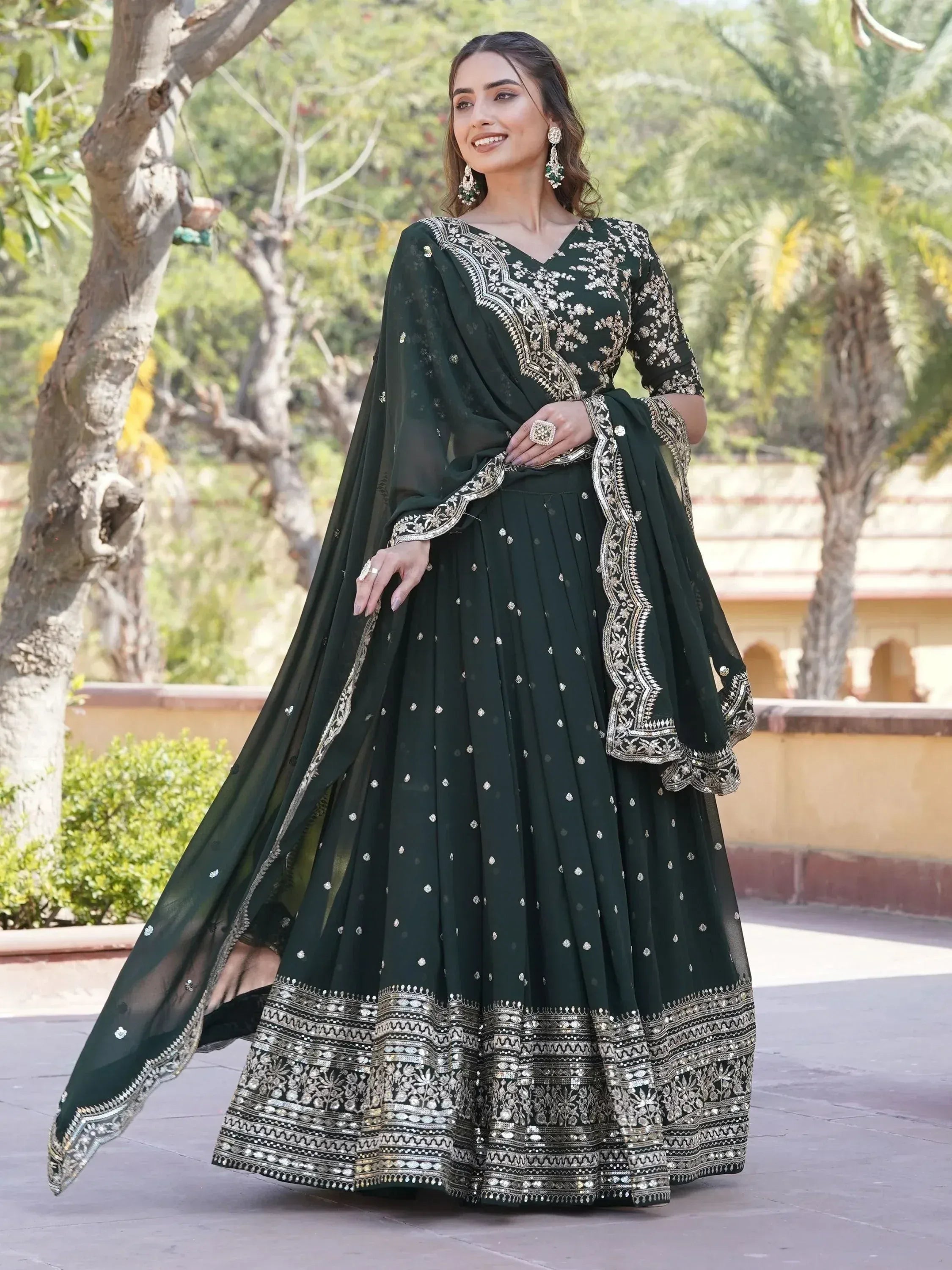 Emerald green embroidered lehenga choli with gold detailing, perfect for Indian ethnic occasions