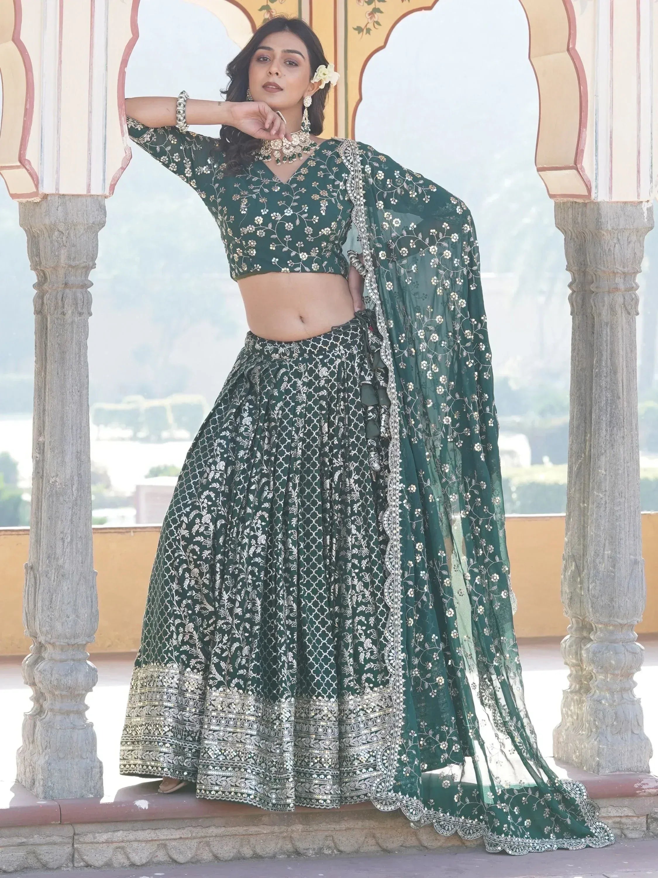 Emerald green embroidered lehenga choli with floral motifs, perfect for Indian ethnic wear and festive occasions.