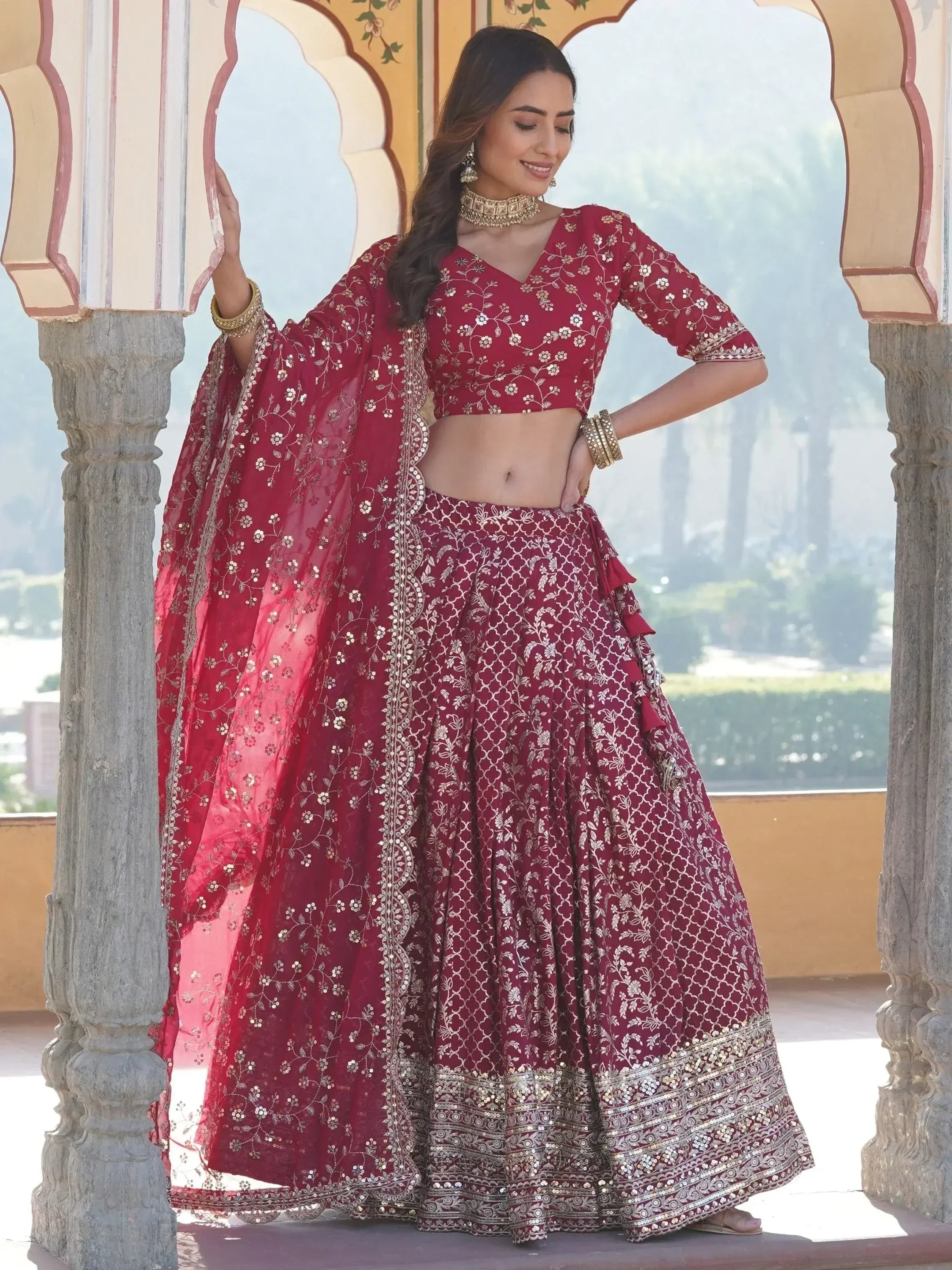 Maroon designer lehenga choli with gold embroidery, perfect for Indian weddings and festive occasions
