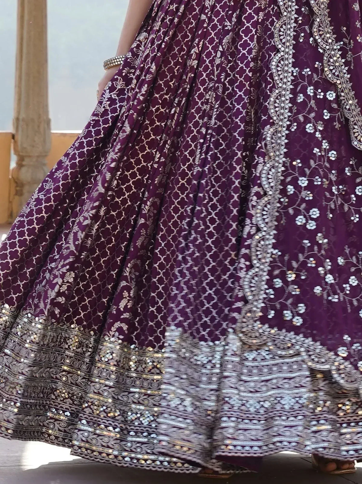 Purple designer lehenga with intricate silver embroidery and sequin work, perfect for Indian ethnic wear.