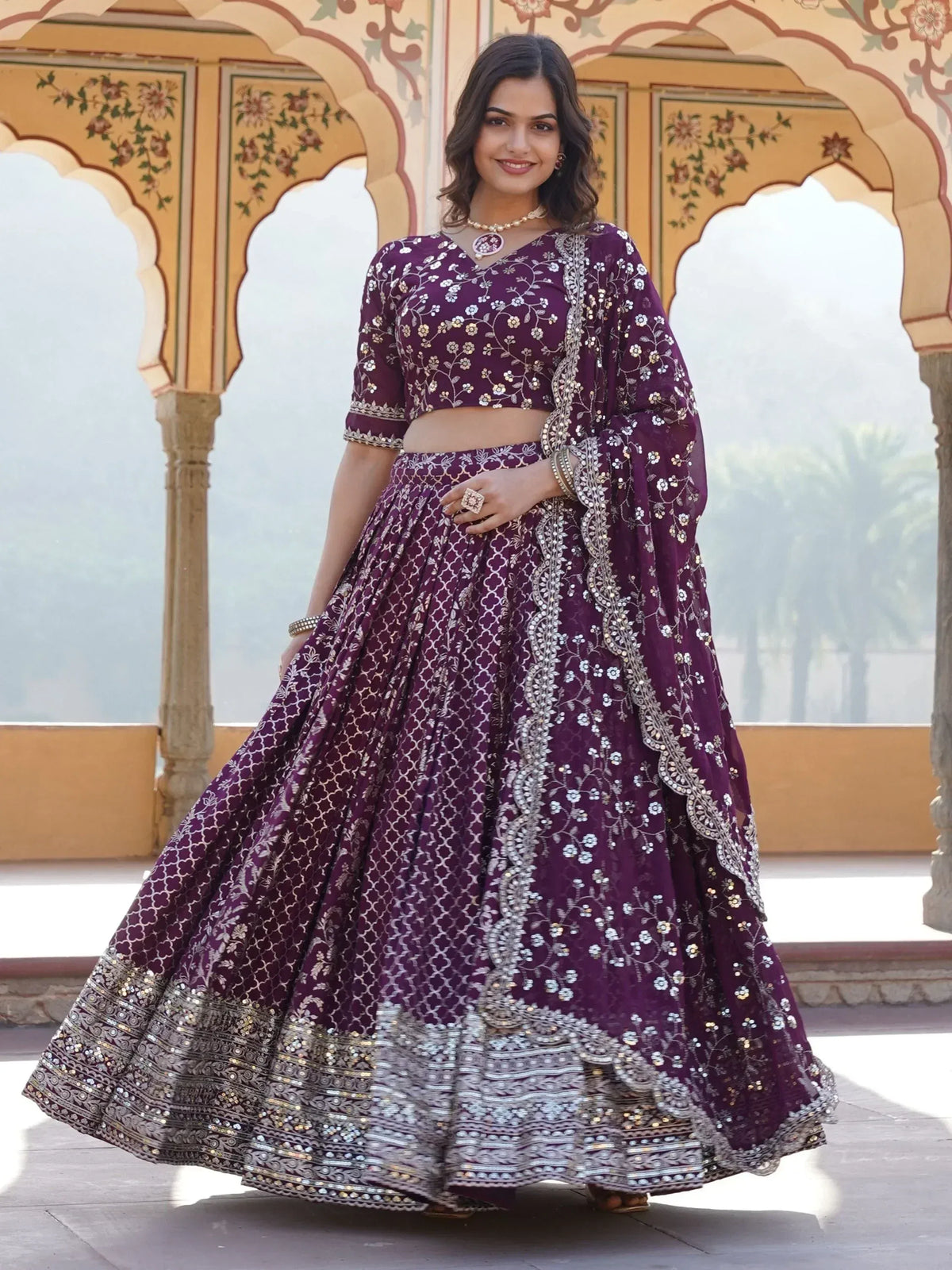 Purple embroidered lehenga choli with floral motifs, perfect for Indian ethnic wear and festive occasions.