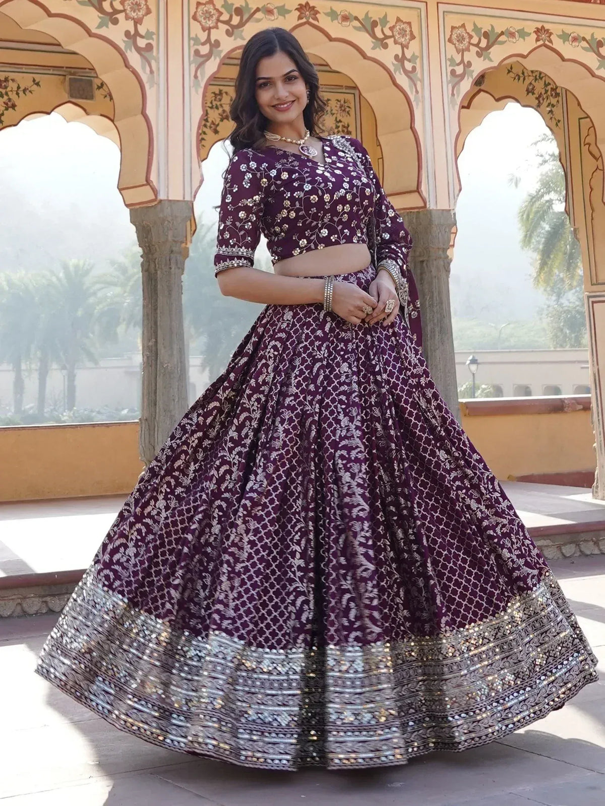 Purple floral embroidered lehenga choli with silver border, perfect for Indian weddings and festivals