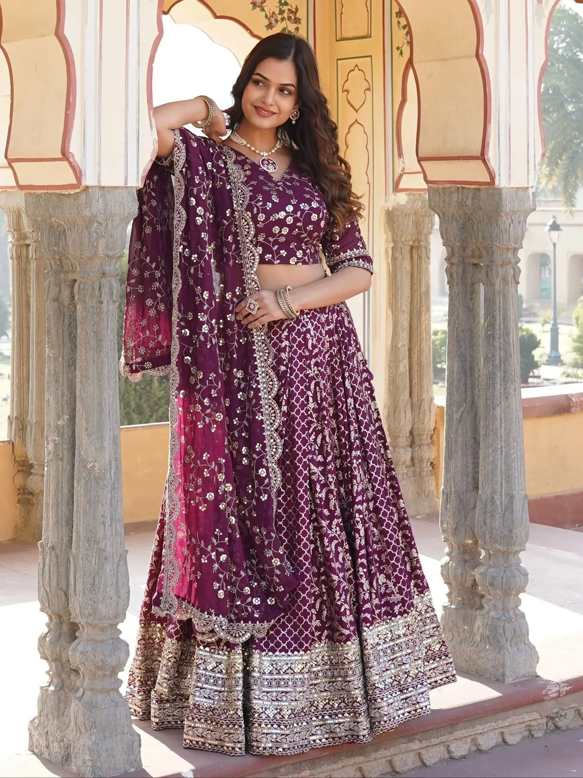 Purple embroidered lehenga choli with floral motifs, perfect for Indian ethnic occasions and weddings.