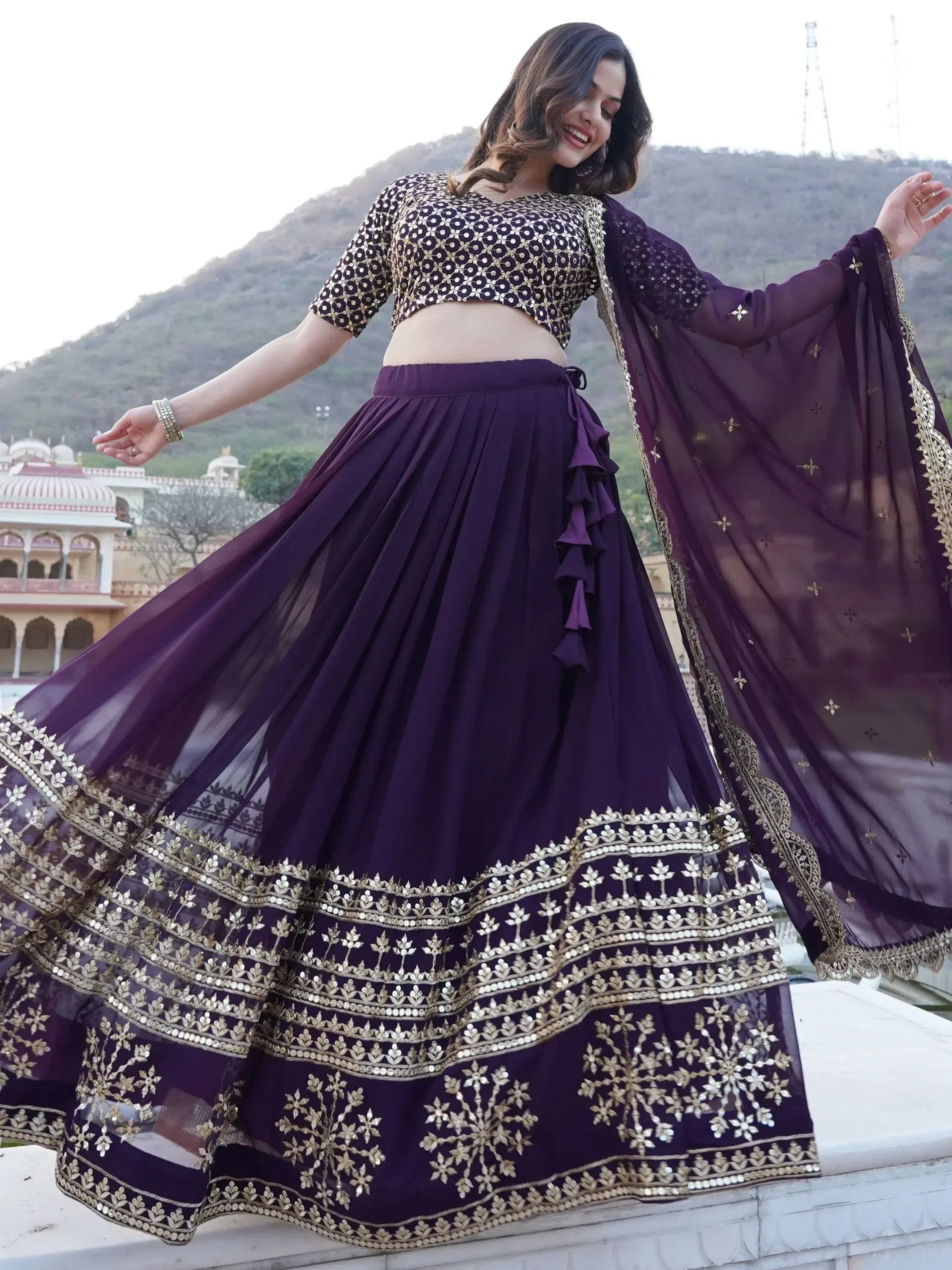 Purple designer lehenga choli with gold embroidery, perfect for Indian ethnic wear events