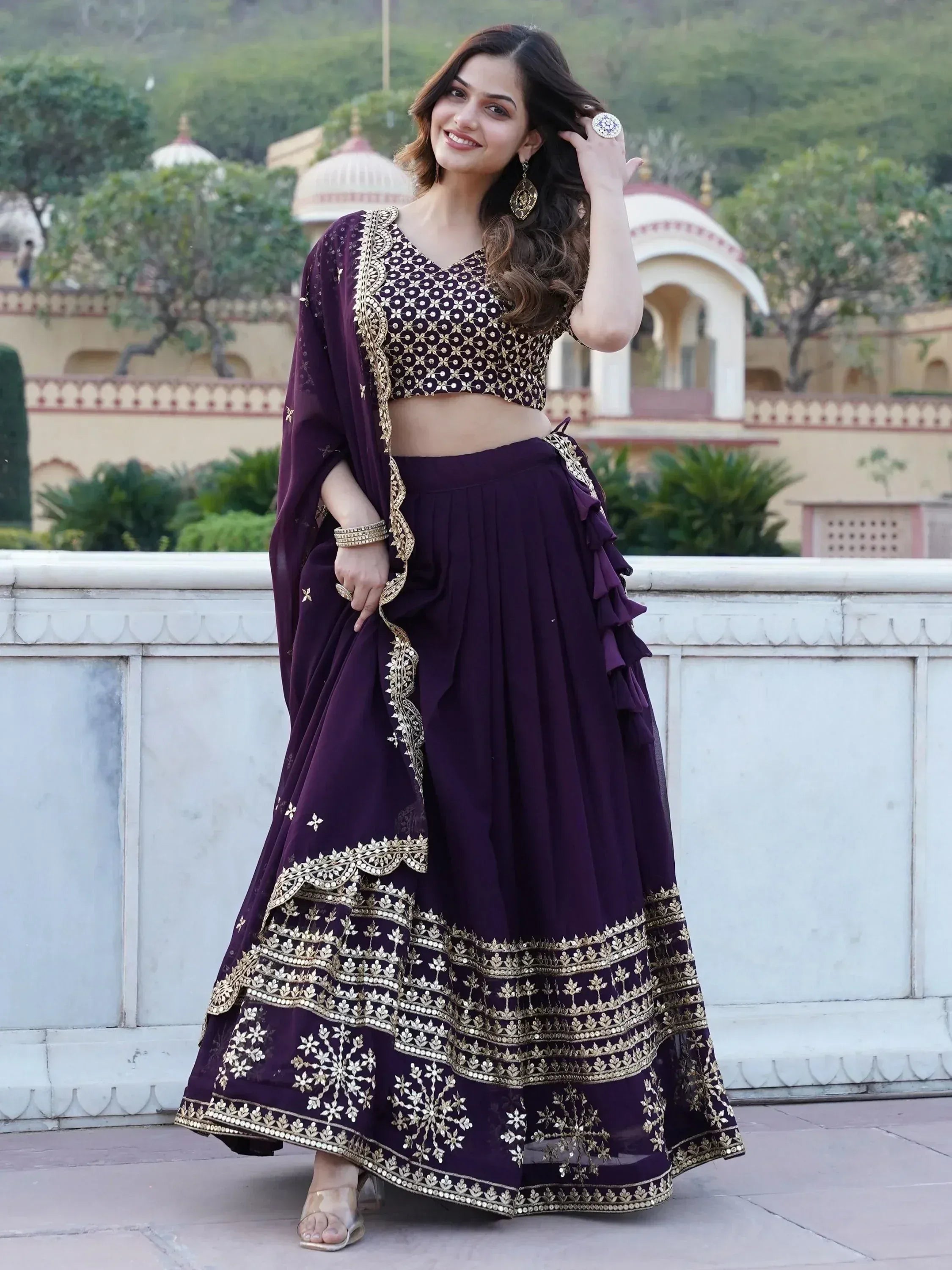 Purple embroidered lehenga choli with gold detailing, perfect for Indian ethnic wear occasions
