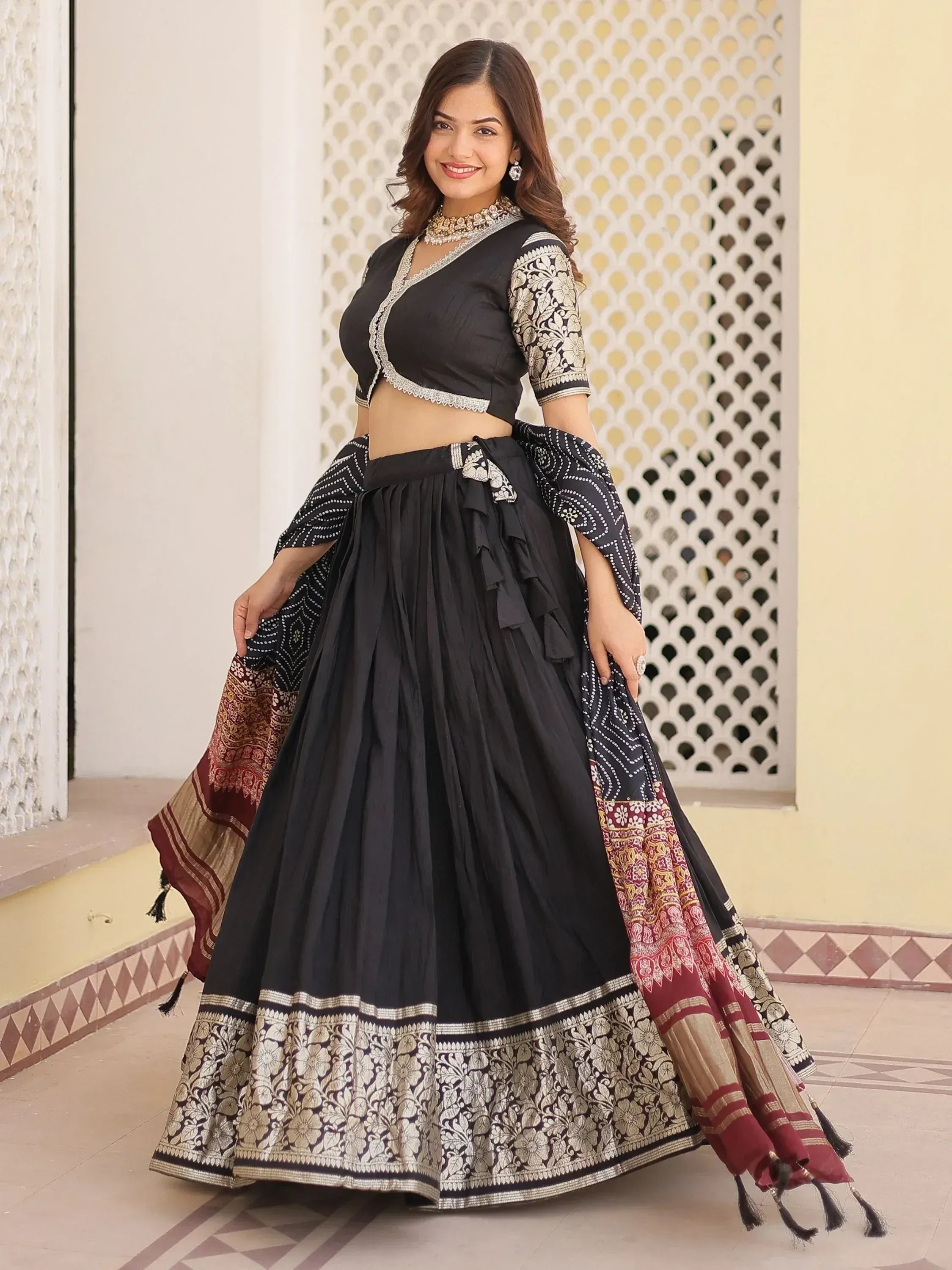 Black designer lehenga choli with silver embroidery and printed dupatta, perfect for Indian ethnic wear occasions.
