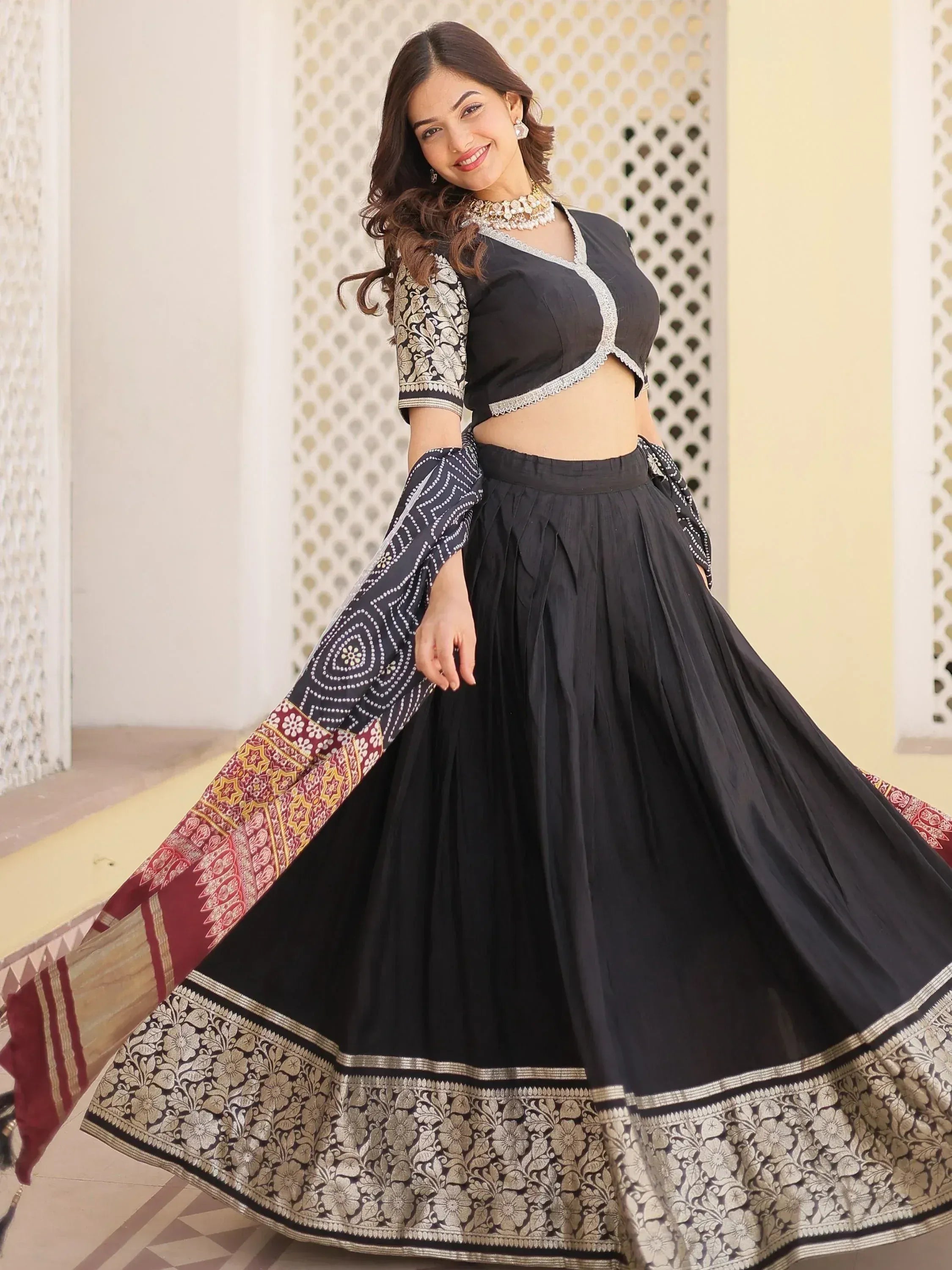 Black designer lehenga choli with floral embroidery and printed dupatta, perfect for Indian ethnic wear occasions.