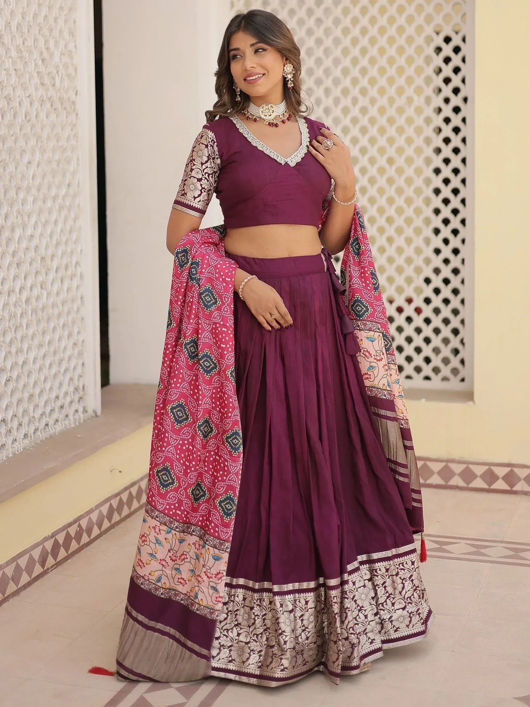 Purple lehenga choli with embroidered blouse and printed dupatta, perfect for Indian ethnic wear occasions.