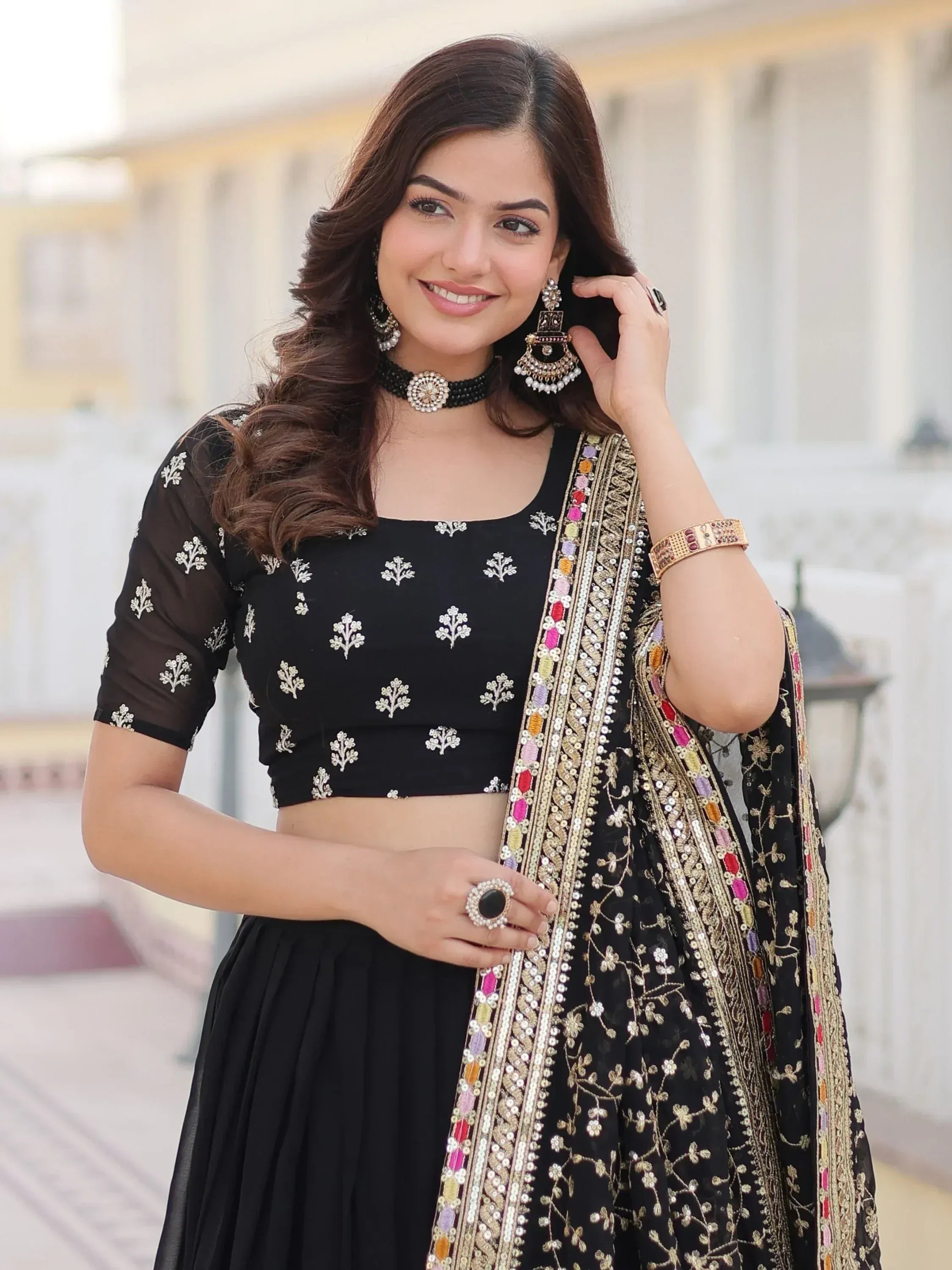 Black embroidered lehenga choli with colorful dupatta, perfect for Indian ethnic wear occasions