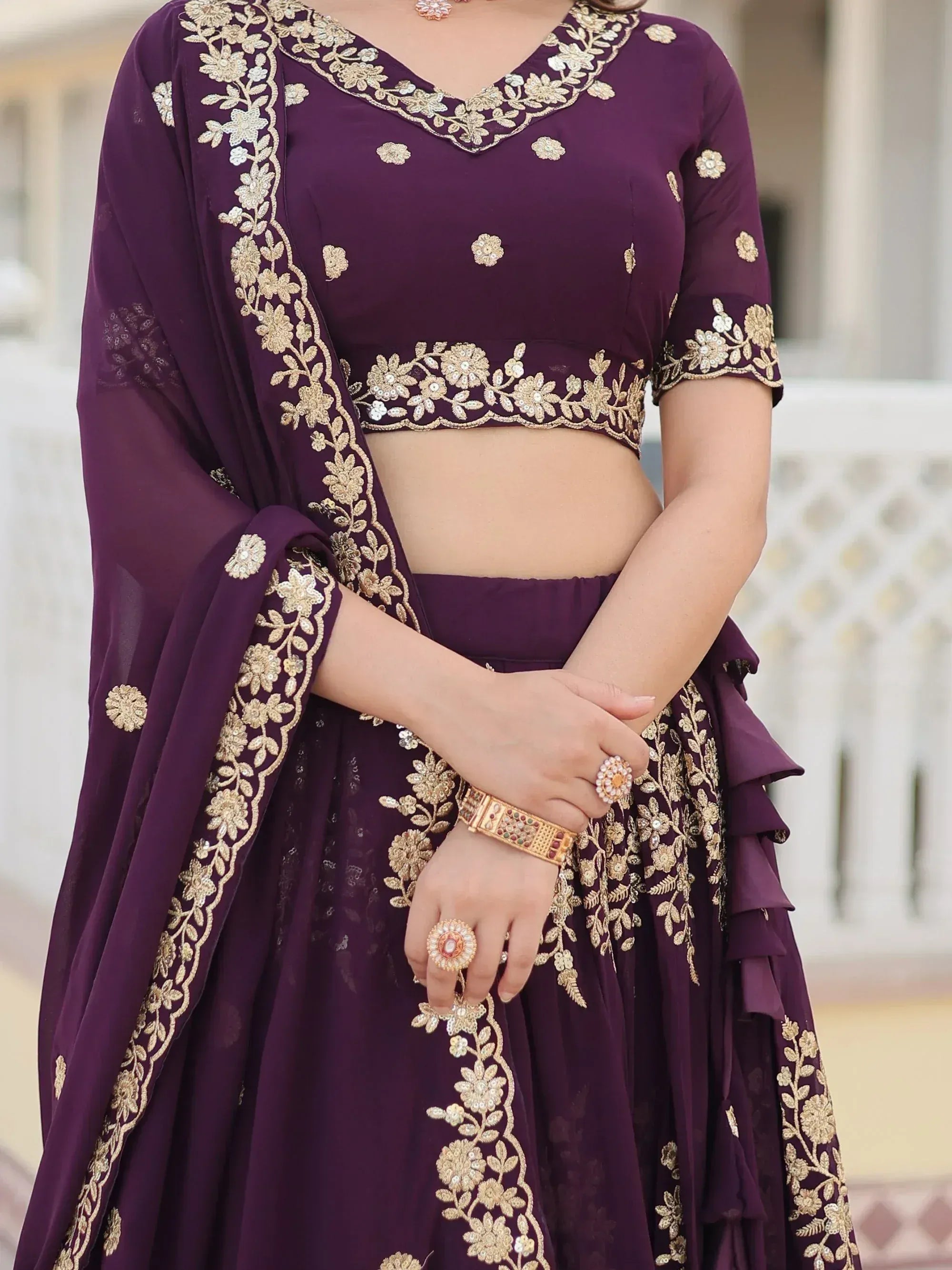 Purple designer lehenga choli with gold floral embroidery and matching dupatta, perfect for Indian ethnic wear occasions