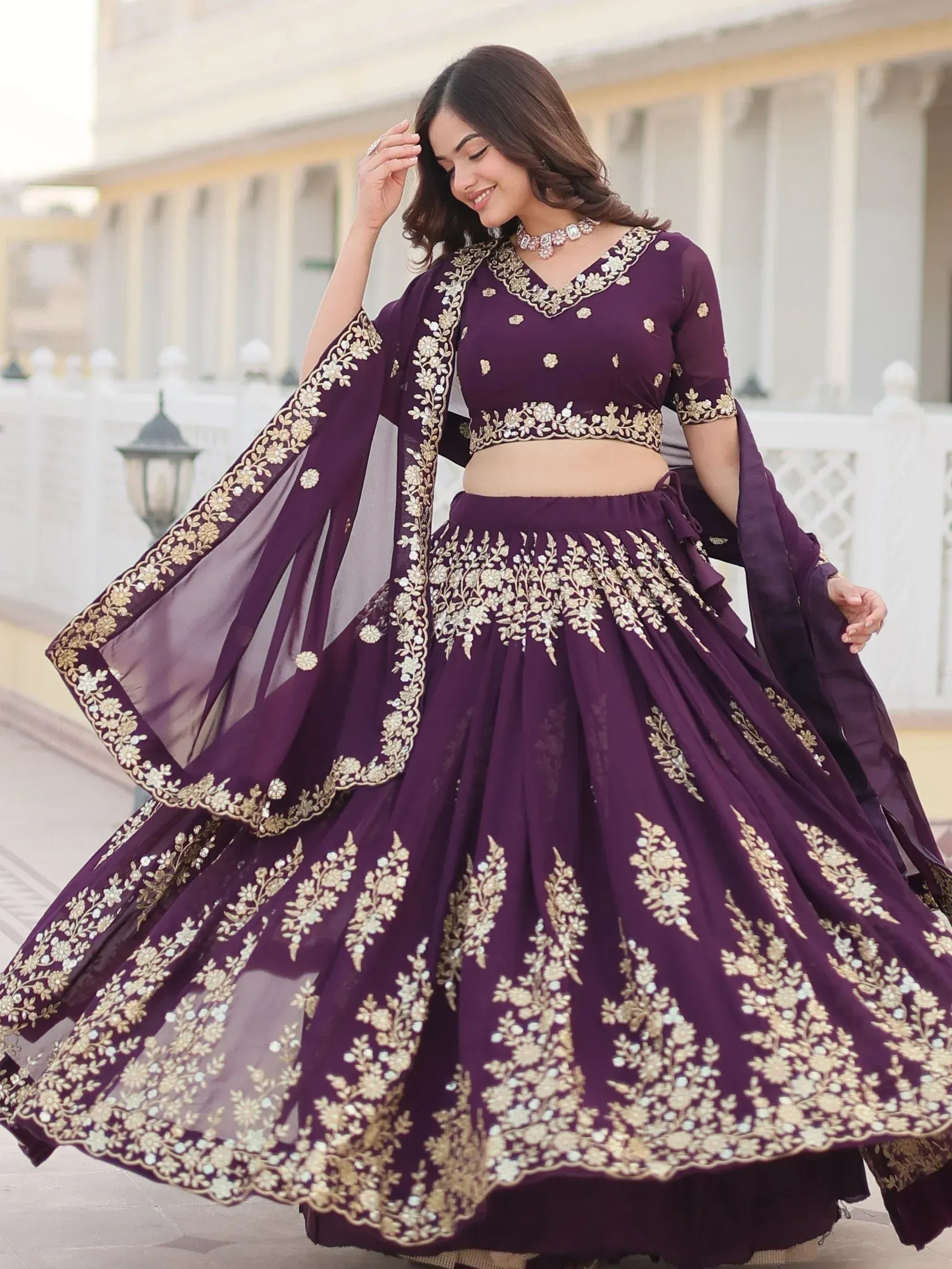 Elegant purple lehenga choli with gold floral embroidery, perfect for Indian ethnic wear occasions.