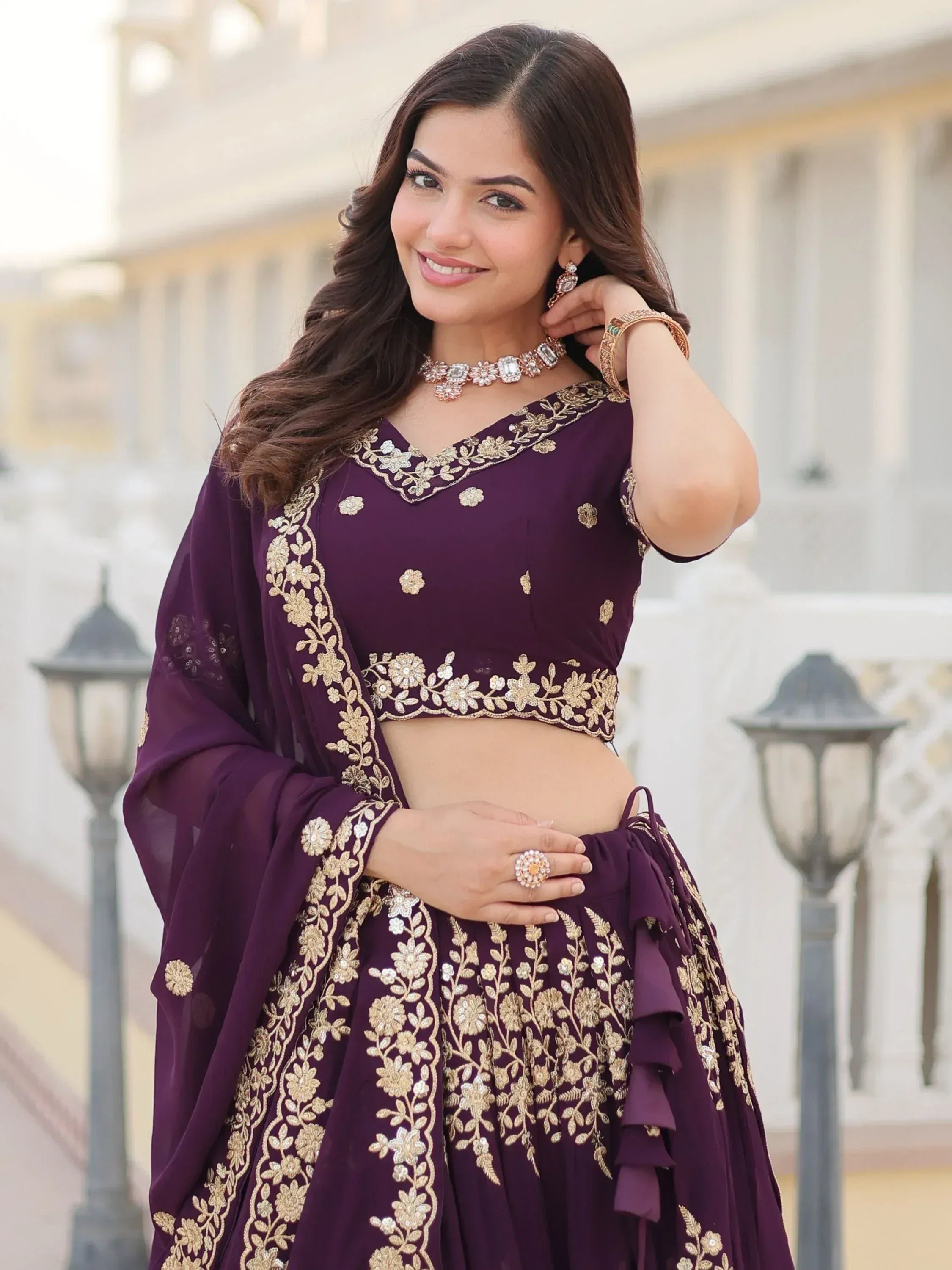 Purple embroidered lehenga choli with gold floral work, perfect for Indian ethnic wear occasions