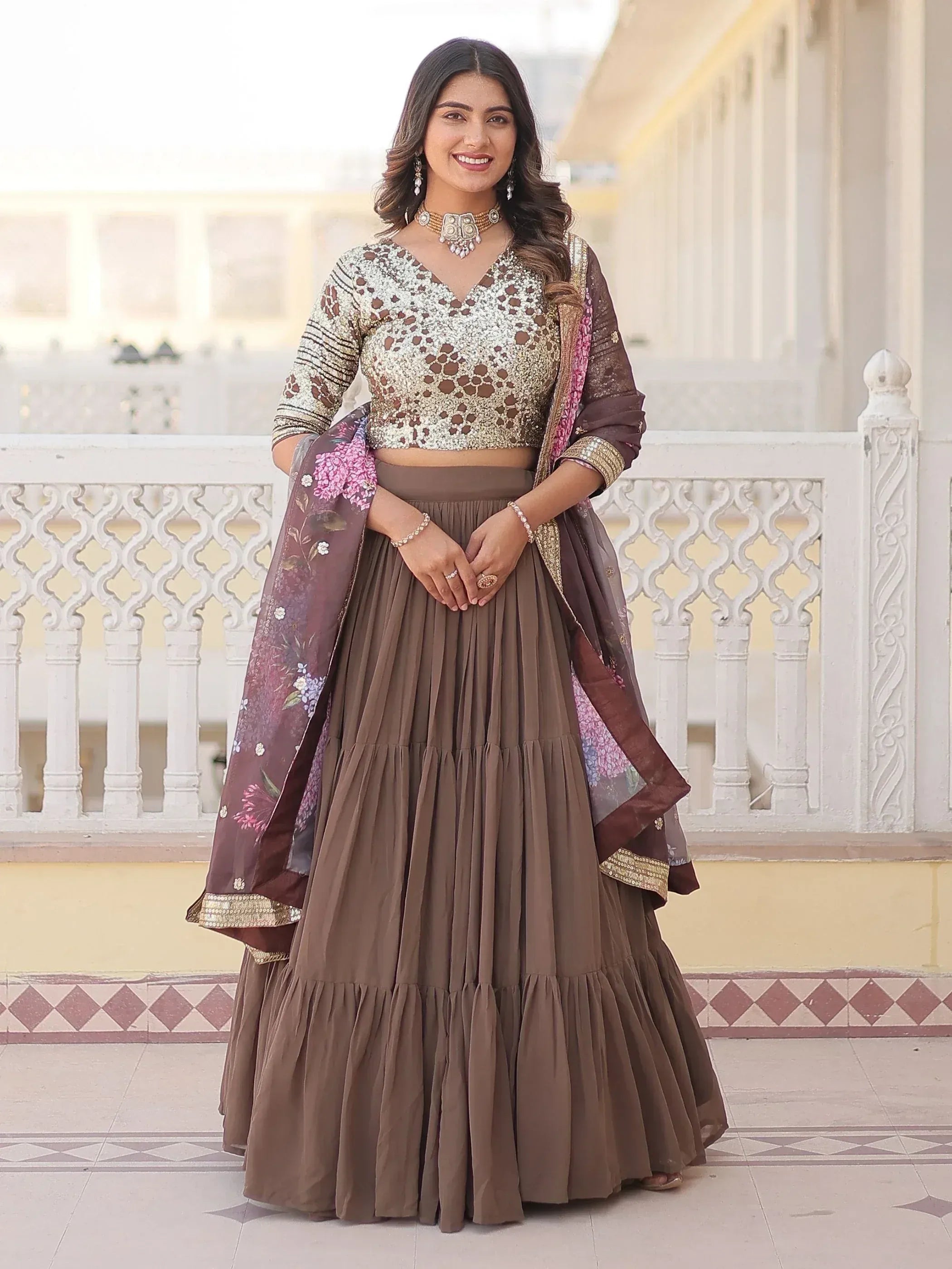 Elegant brown lehenga choli with sequin blouse and floral dupatta, perfect for Indian ethnic occasions