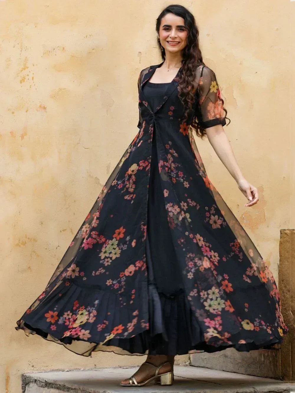 Black floral ethnic gown with sheer sleeves, perfect for Indian occasions and festive wear.