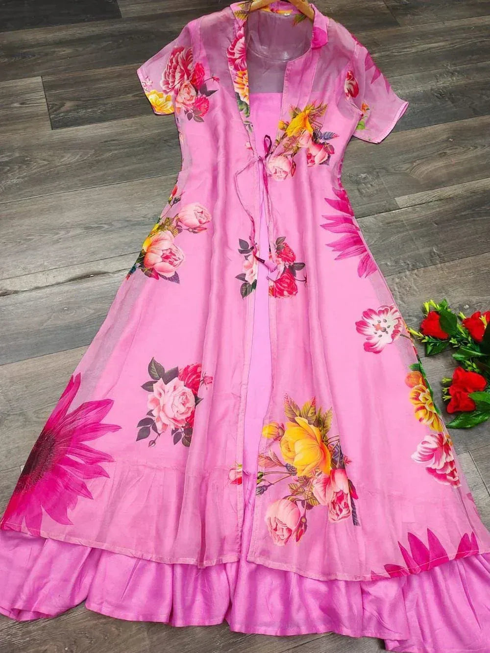 Pink floral ethnic gown with layered ruffle hem, perfect for Indian occasions