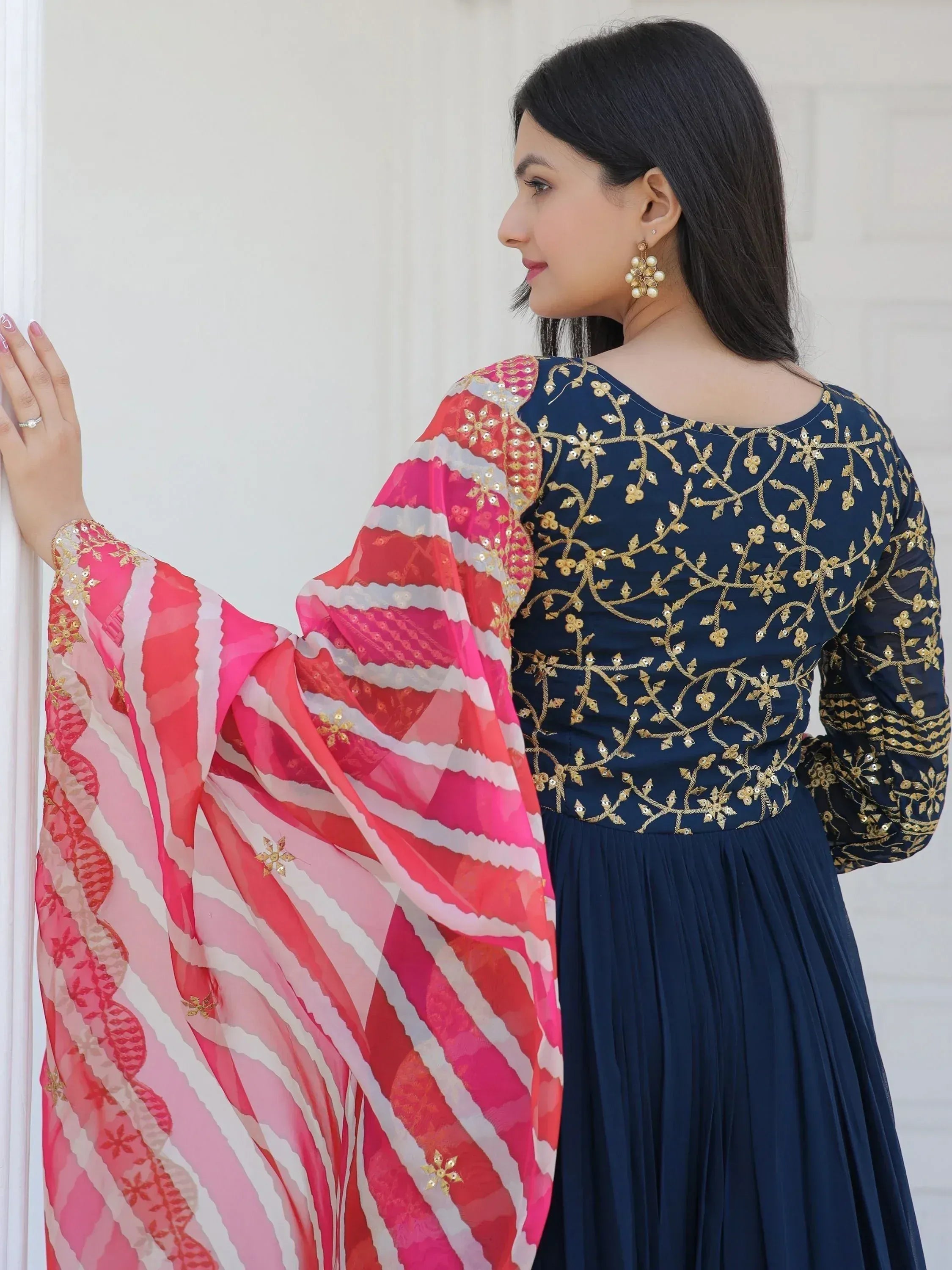 Navy blue embroidered ethnic gown with pink patterned dupatta, gold floral detailing, perfect for Indian occasions