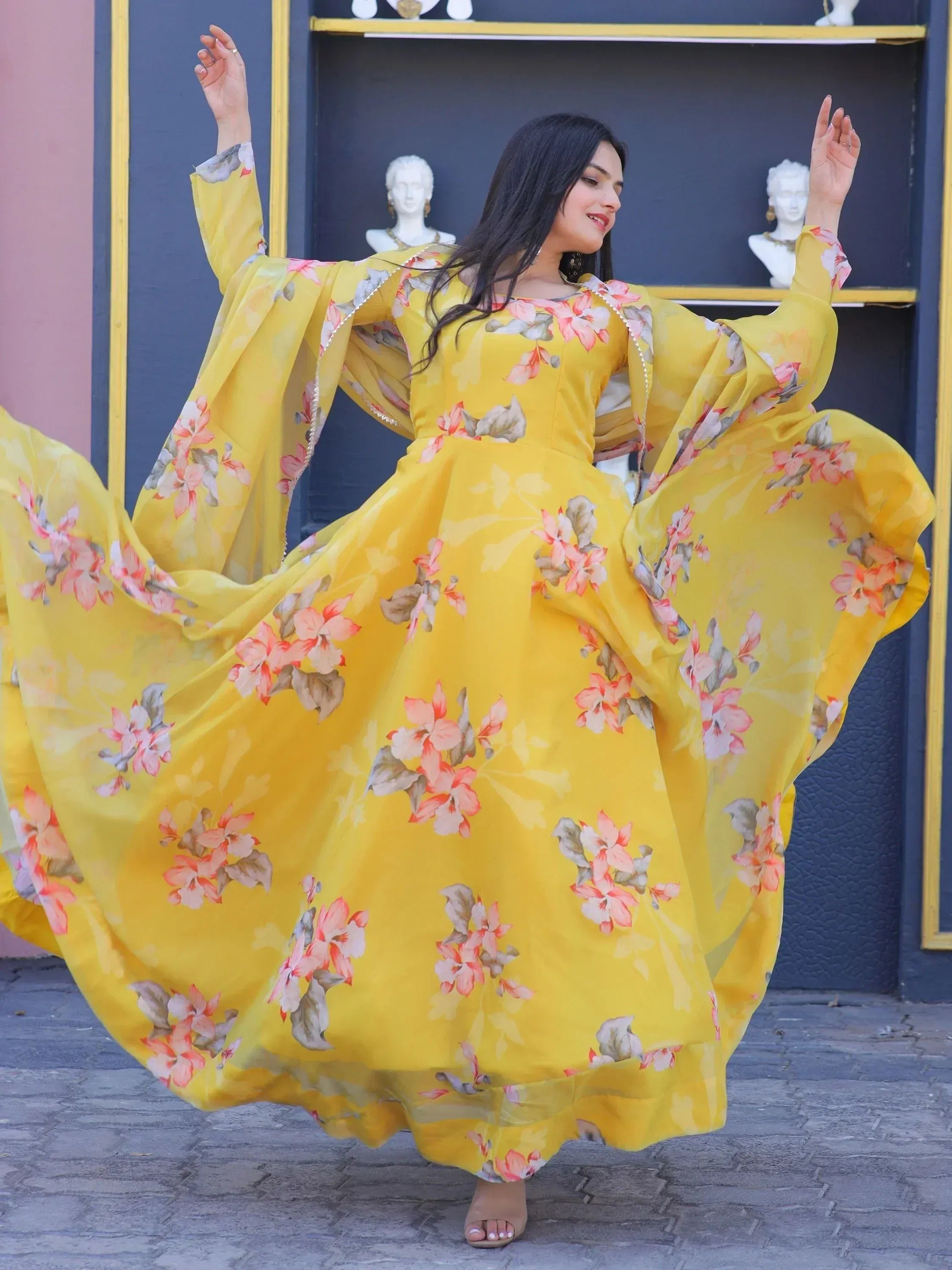 Yellow floral ethnic gown with flared sleeves, perfect for festive occasions and Indian wear