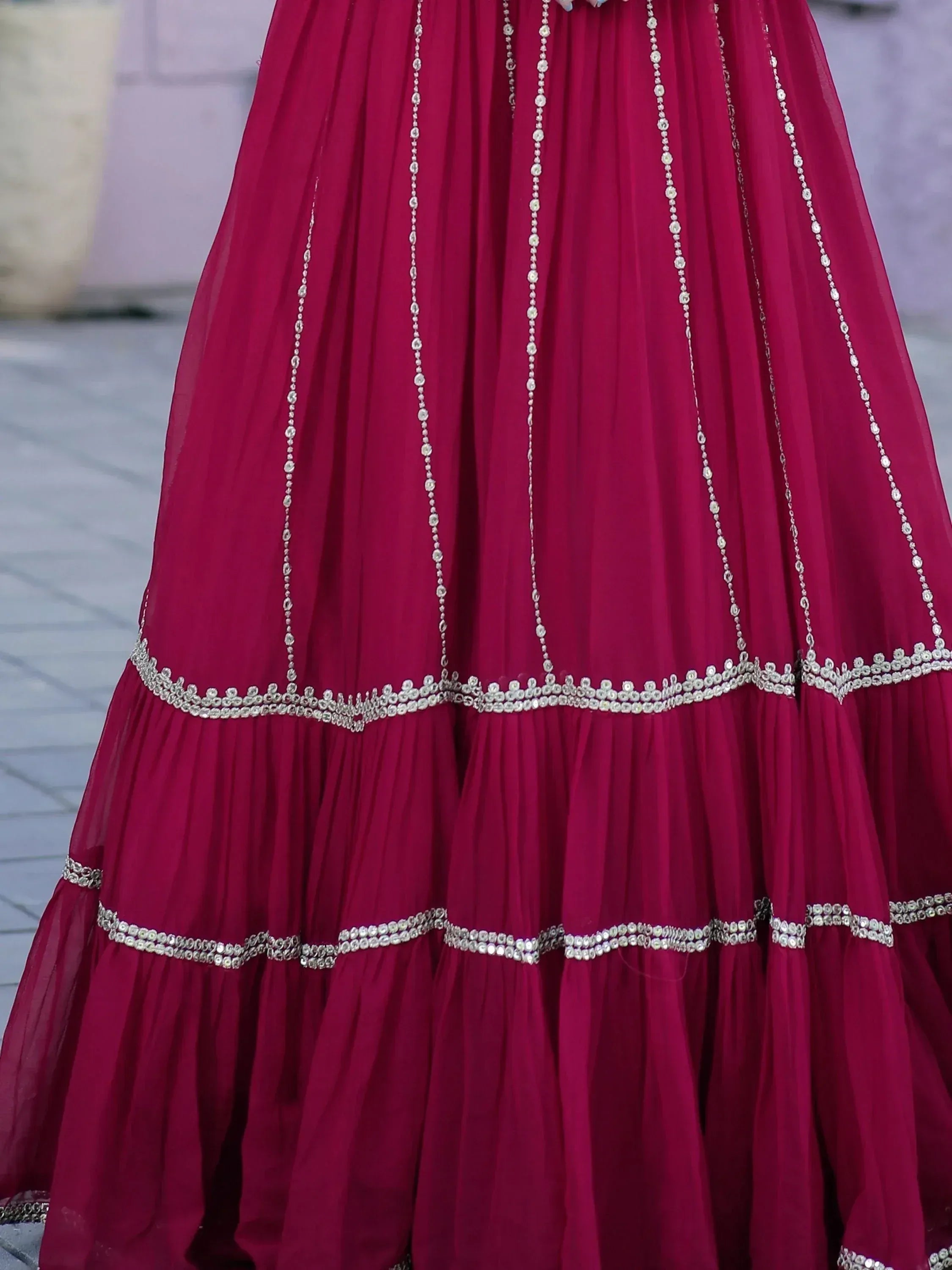 Deep pink ethnic lehenga with silver beadwork and layered skirt for Indian weddings