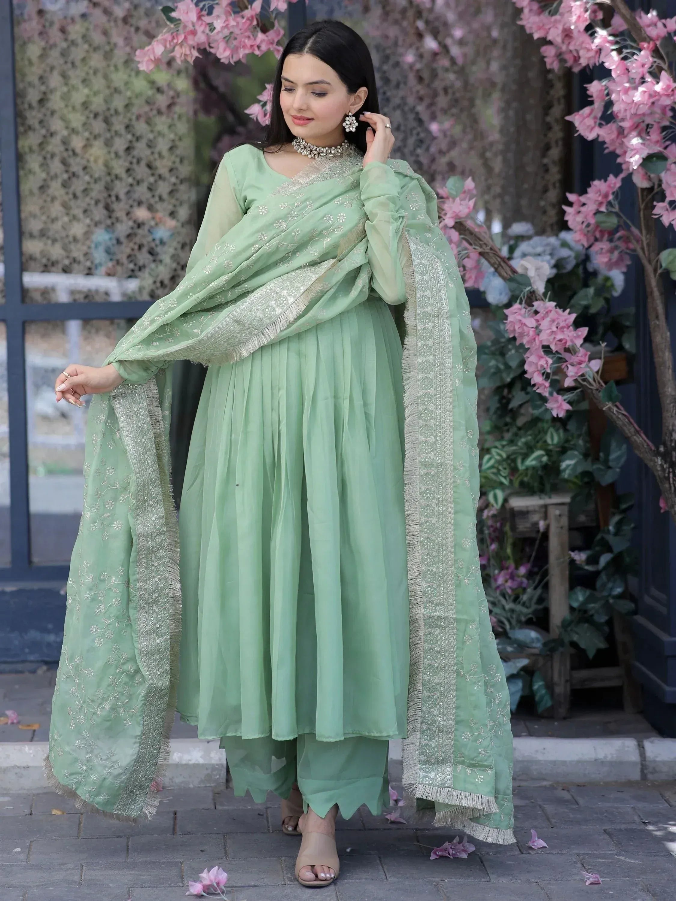 Mint green embroidered salwar kameez with pleated skirt and dupatta, perfect for ethnic occasions