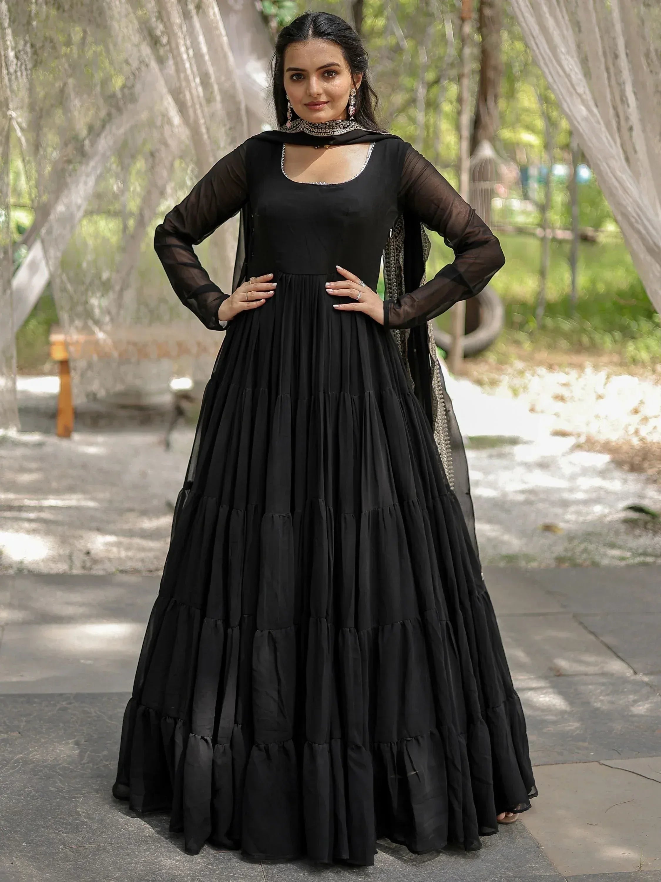 Black tiered ethnic gown with sheer sleeves and embellished neckline for women