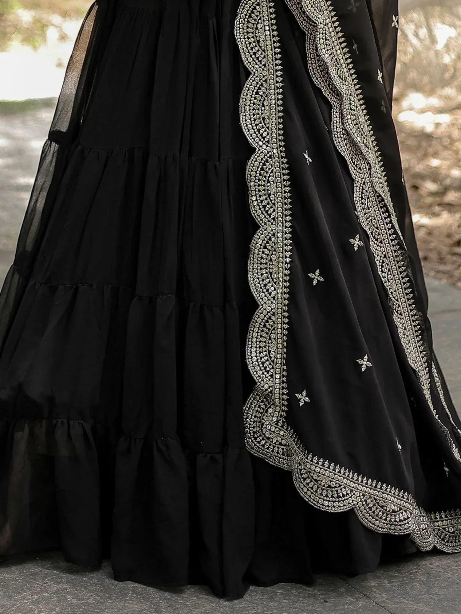 Black ethnic gown with silver embroidery and layered skirt, perfect for Indian occasions