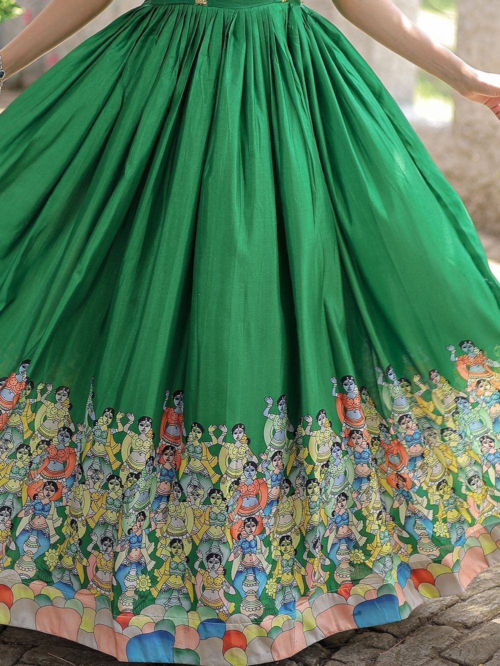 Vibrant green ethnic lehenga skirt with colorful folk dancer print, perfect for Indian celebrations.