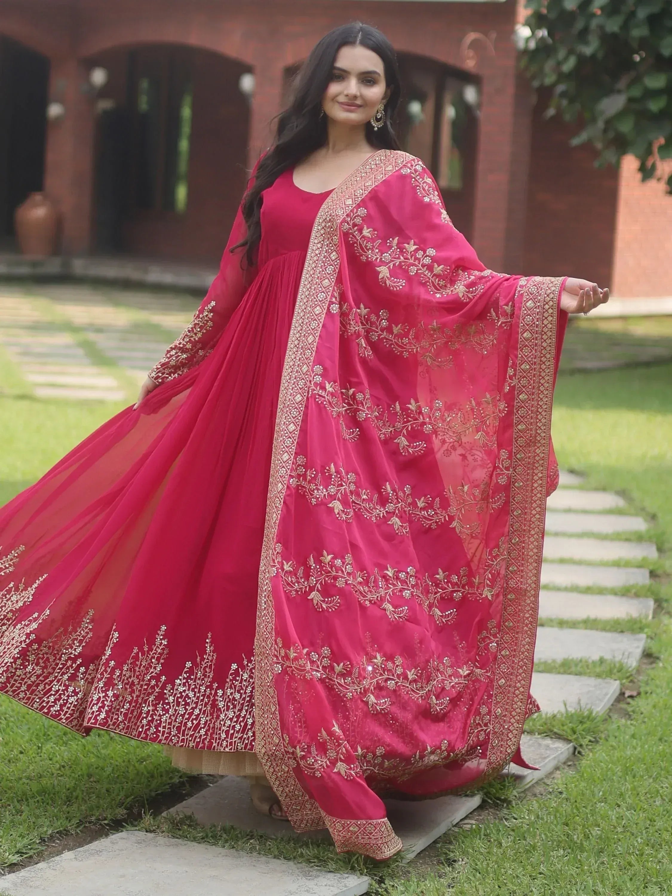 Pink embroidered anarkali gown with gold floral work, perfect for Indian ethnic occasions