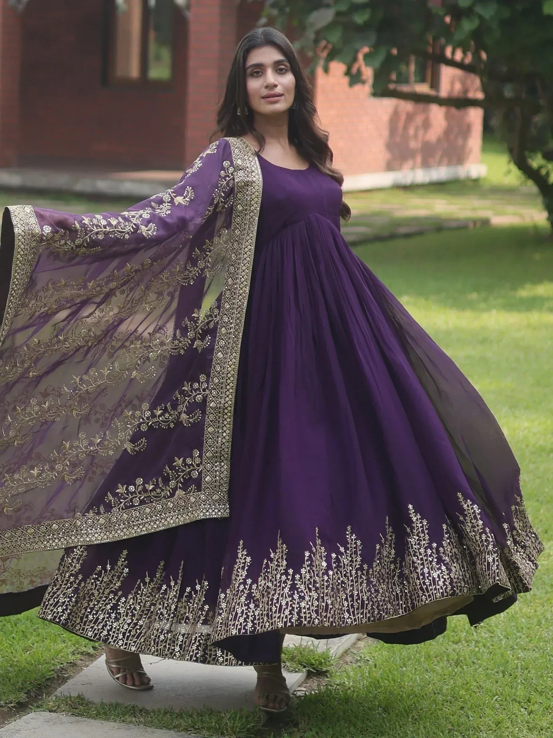 Purple ethnic gown with gold embroidery, perfect for Indian occasions and festive wear.