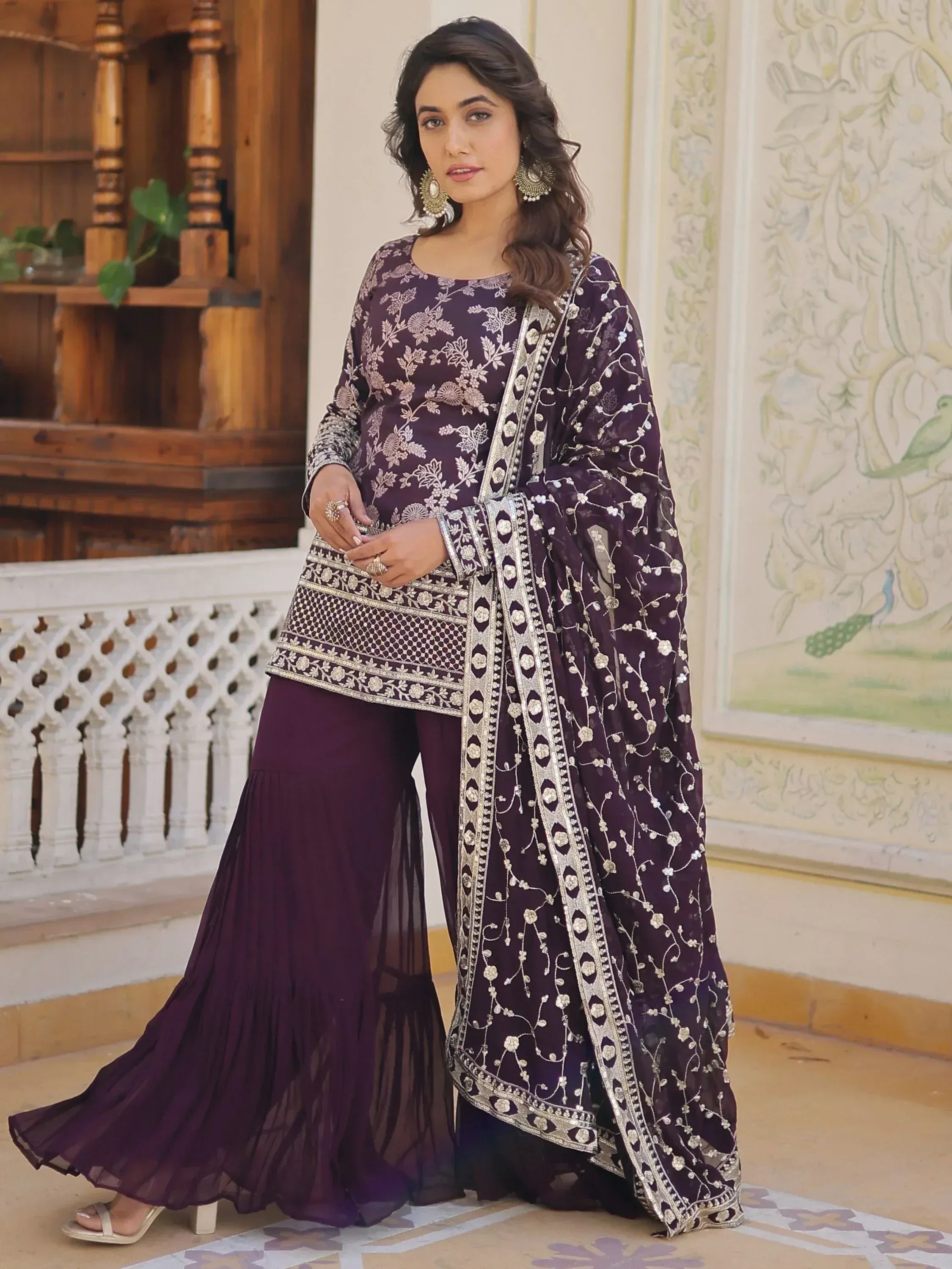 Elegant purple embroidered salwar kameez with floral detailing and dupatta for festive occasions