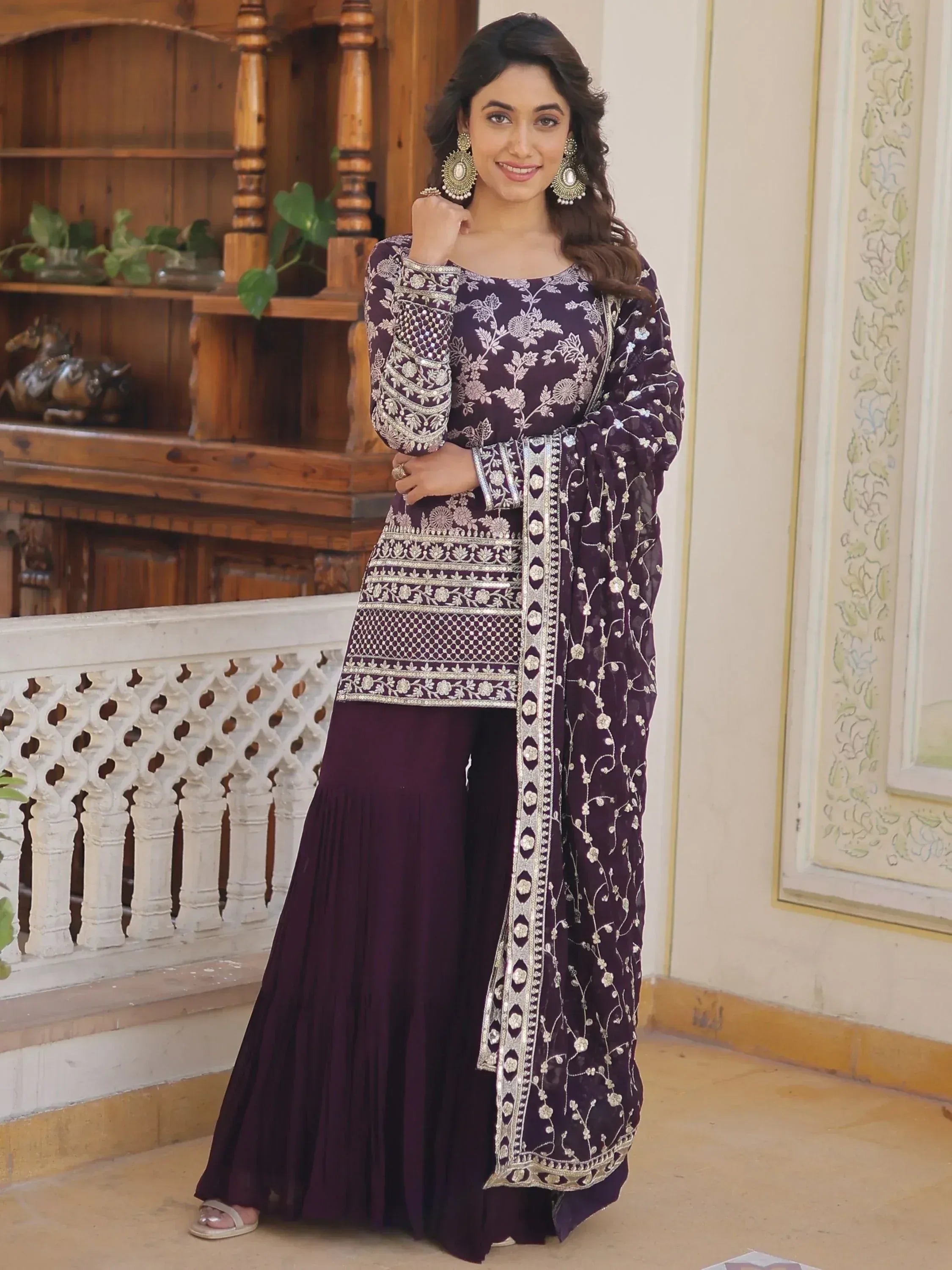 Elegant purple ethnic wear with intricate silver embroidery, floral patterns, and pleated palazzo pants for women.