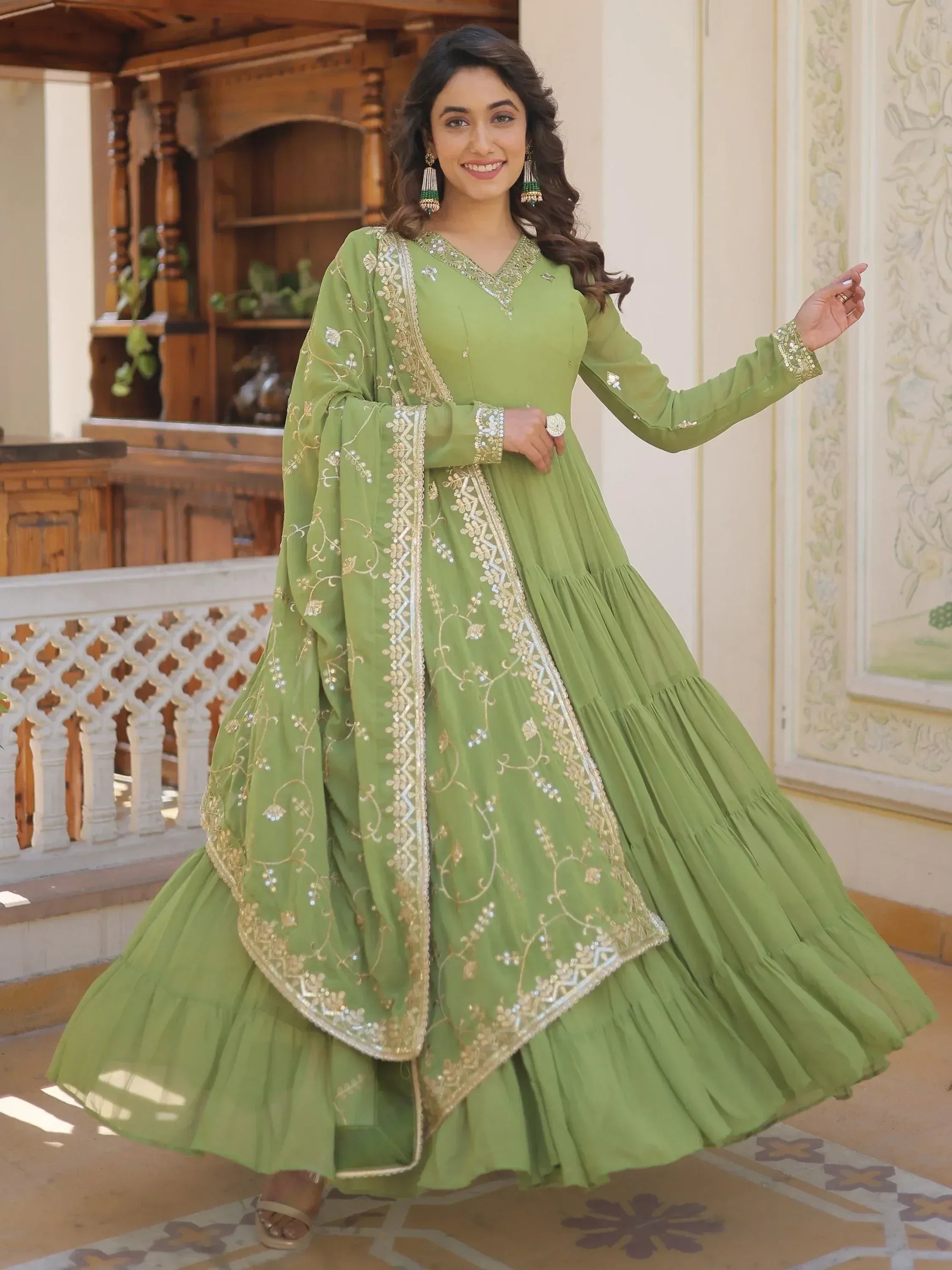 Green embroidered anarkali suit with gold detailing, perfect for Indian ethnic wear occasions
