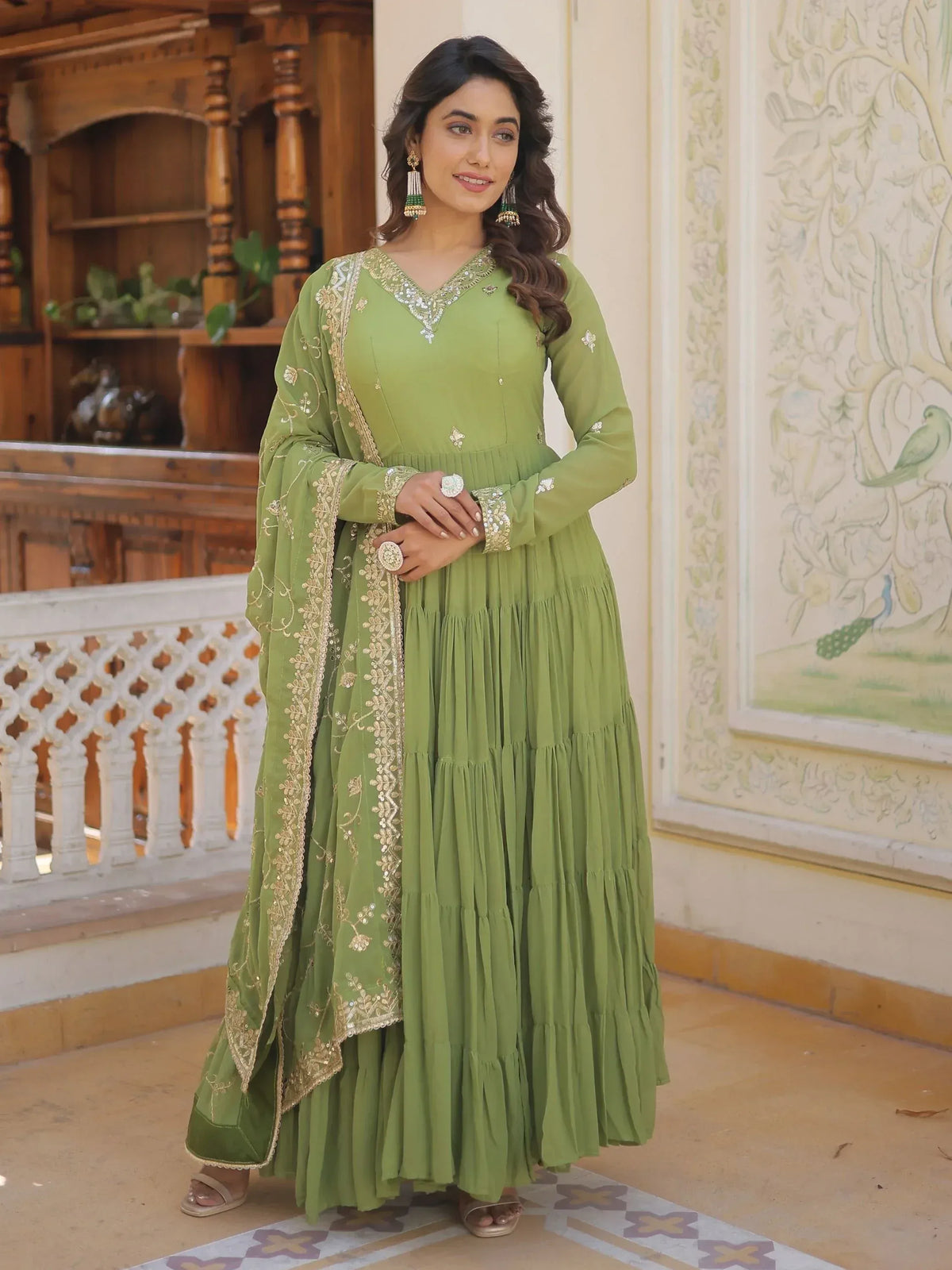 Green embroidered anarkali suit with gold detailing, perfect for Indian ethnic wear occasions.
