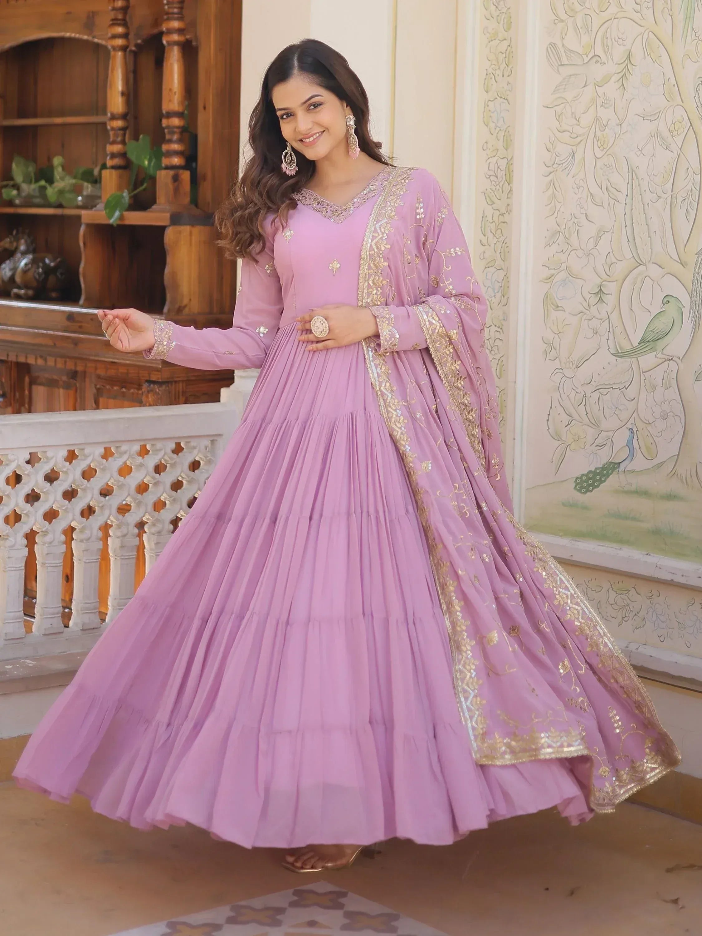 Lavender ethnic gown with gold embroidery, perfect for Indian weddings and festive occasions