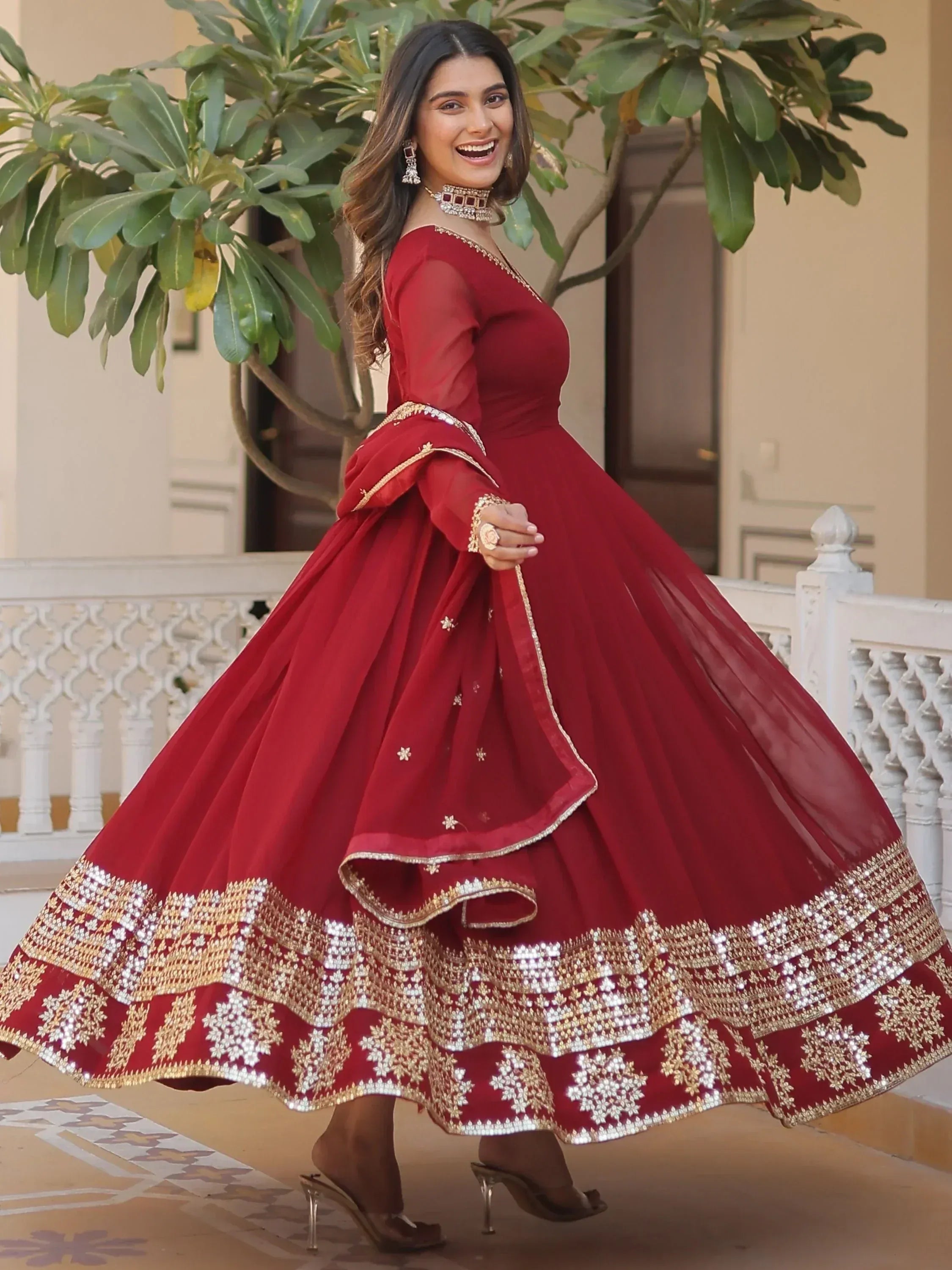 Red designer lehenga choli with gold mirror work, perfect for Indian ethnic wear events